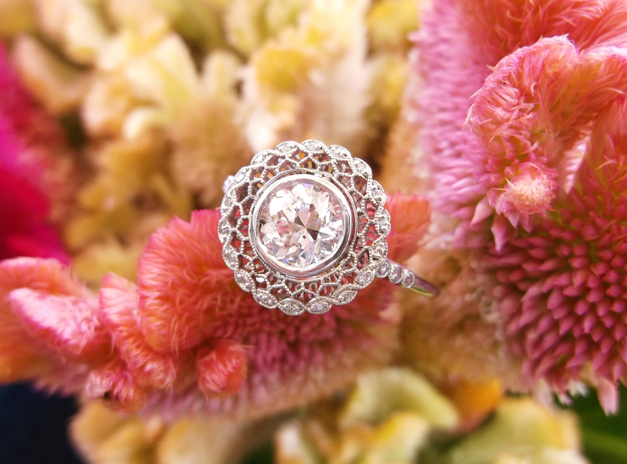 SOLD - Lacy Art Deco diamond and platinum ring set with a 0.98 carat Old European cut diamond in the center.