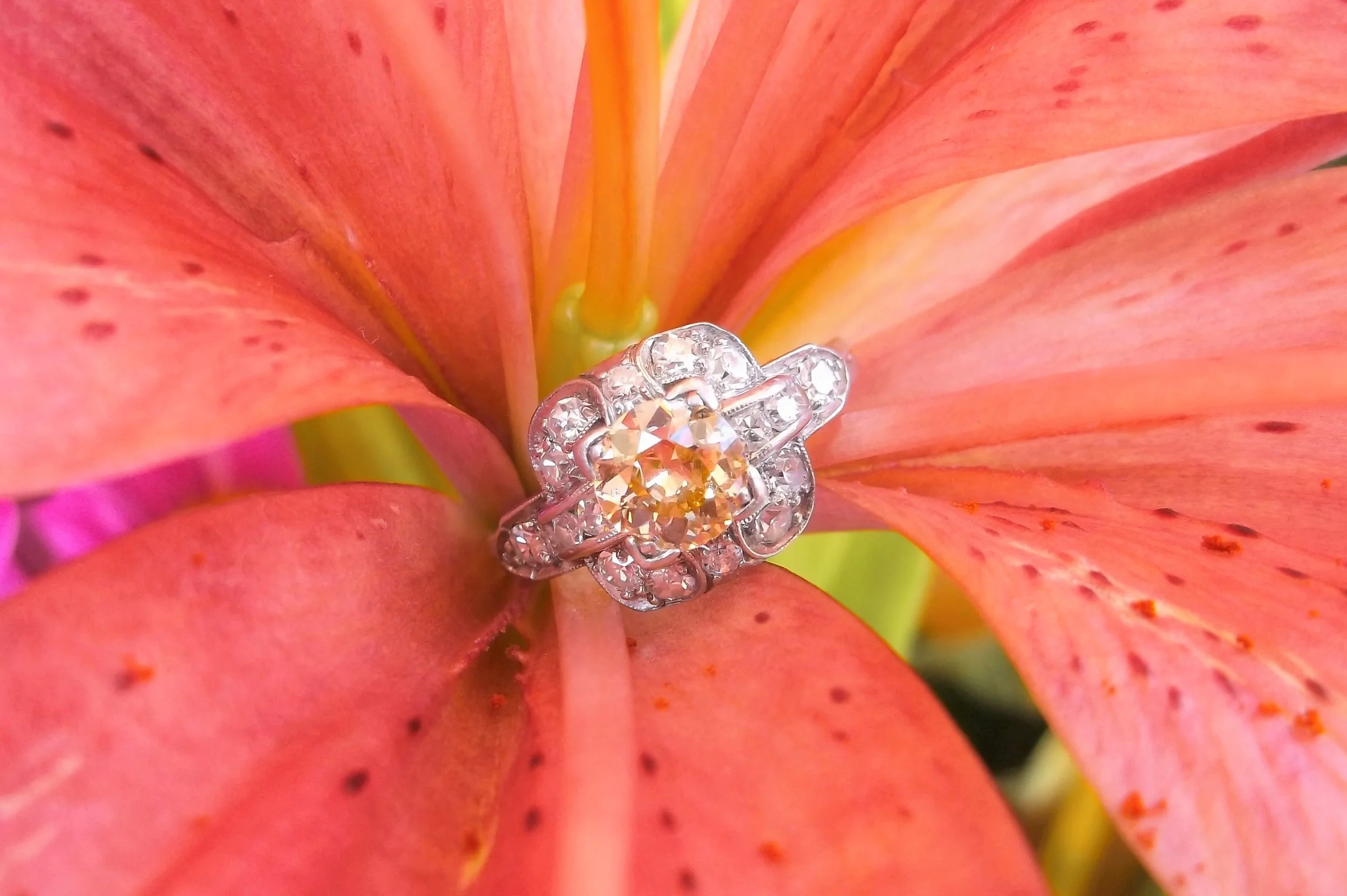 SOLD - Whimsical 0.62 carat Old Mine cut diamond set in an Art Deco diamond and platinum mounting.