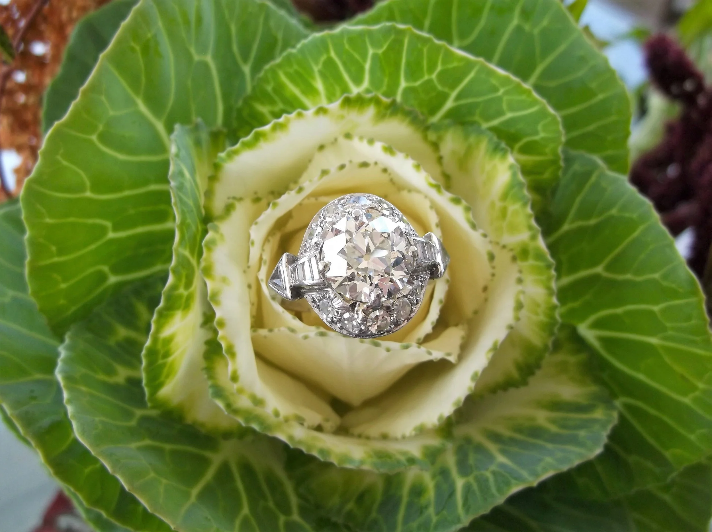 Breathtaking 1920's 3.19 carat Old European cut diamond set in a gorgeous platinum and diamond detail mounting.