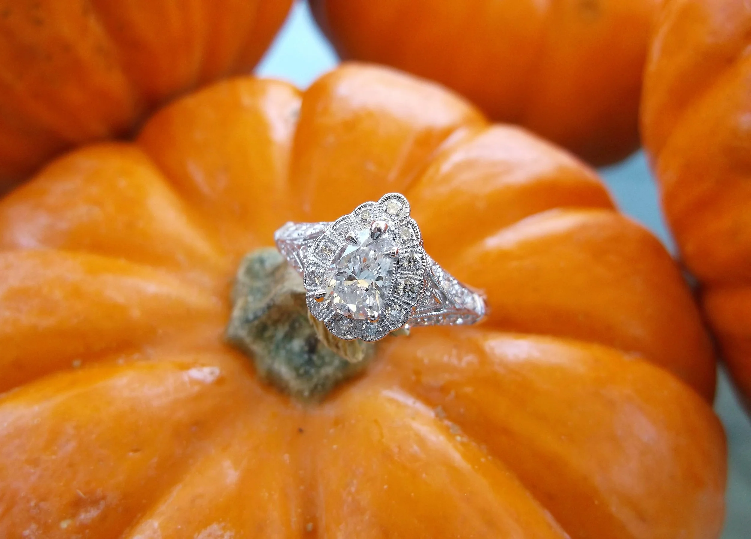 SOLD - Enchanting 0.62 carat pear shaped diamond set in a detailed diamond and white gold mounting.