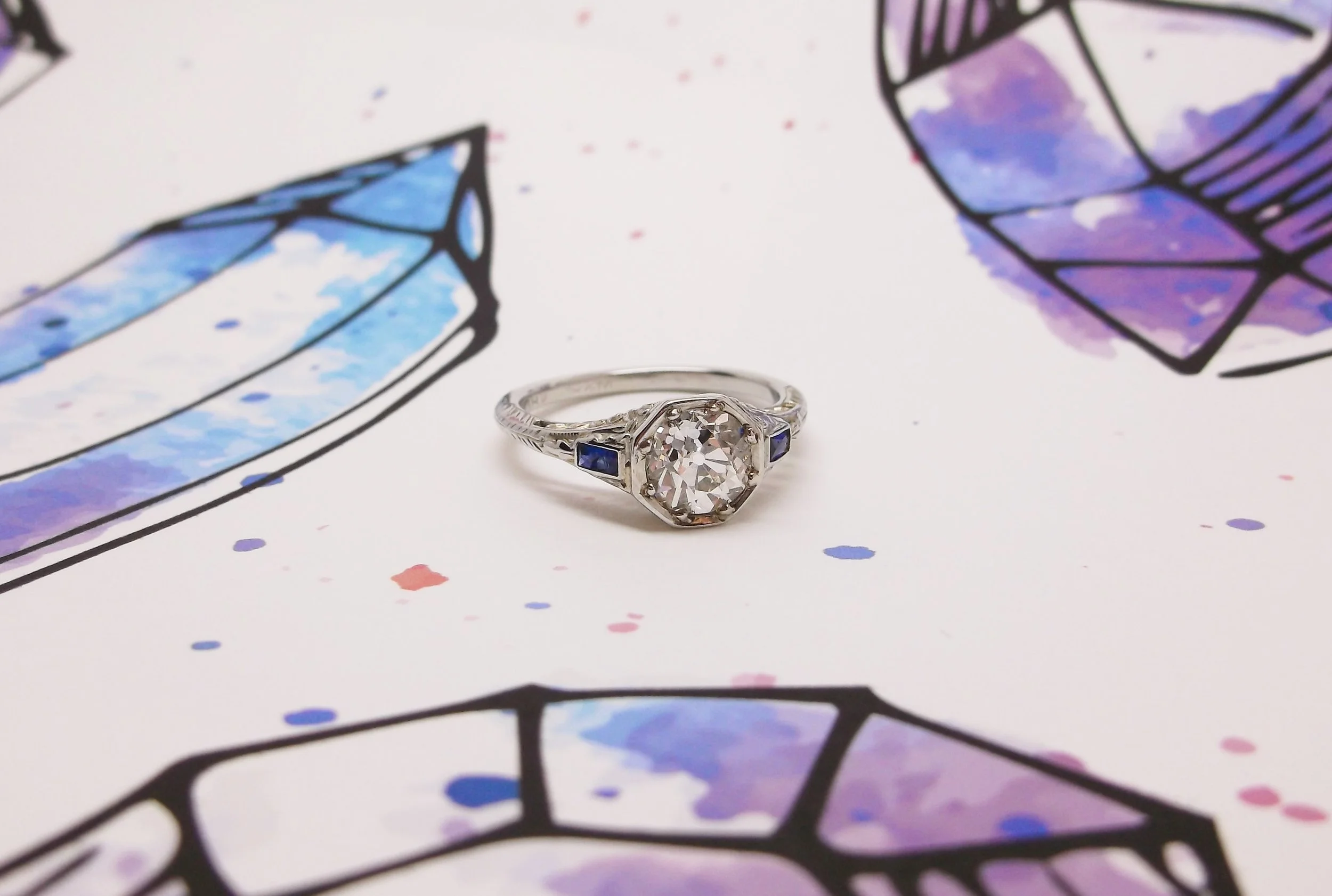 SOLD - Crystalline 1.17 carat Old European cut diamond set in a sapphire and white gold detail mounting.