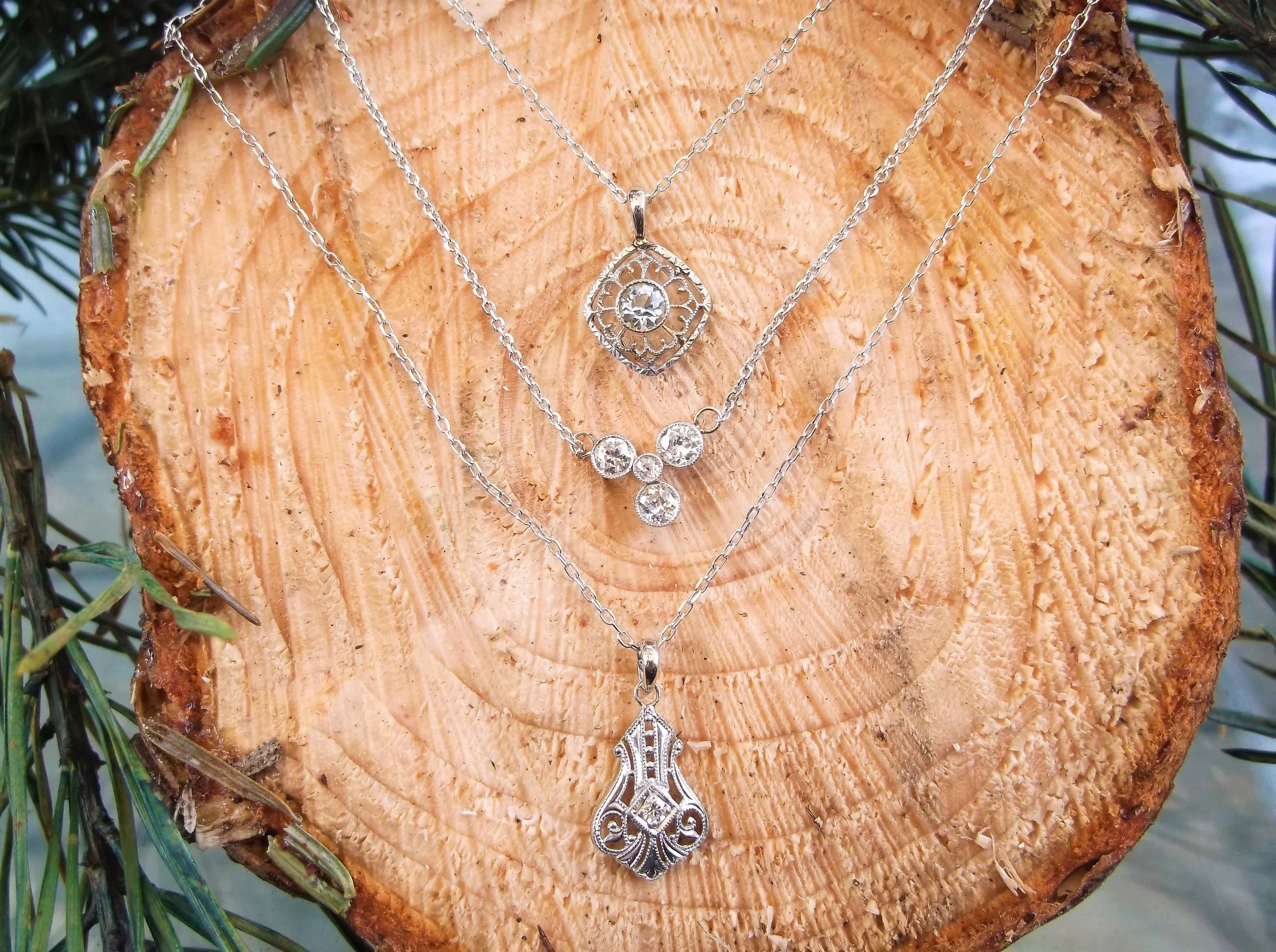 Top: SOLD - Art Deco aquamarine and filigree pendant set in white gold Middle: SOLD - Edwardian era, Old European cut diamond pendant set in platinum topped gold with 0.55 carats total weight in diamonds Bottom: SOLD - 1920's filigree and diamond pendant in white gold