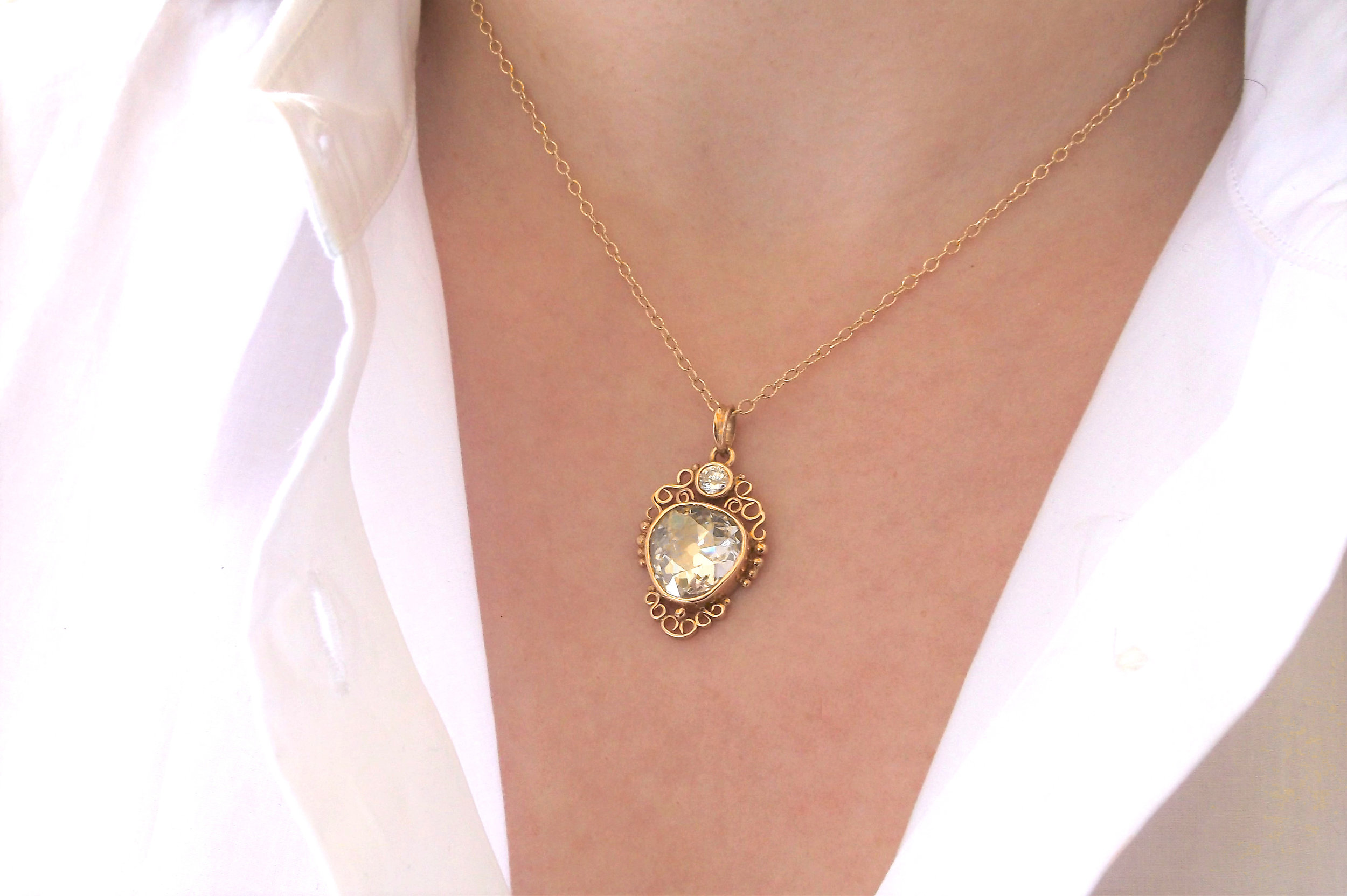 Mesmerizing 5.00 carat Old European cut diamond set in a lovely yellow gold pendant with a 0.33 carat diamond set at the top. Shop this pendant HERE