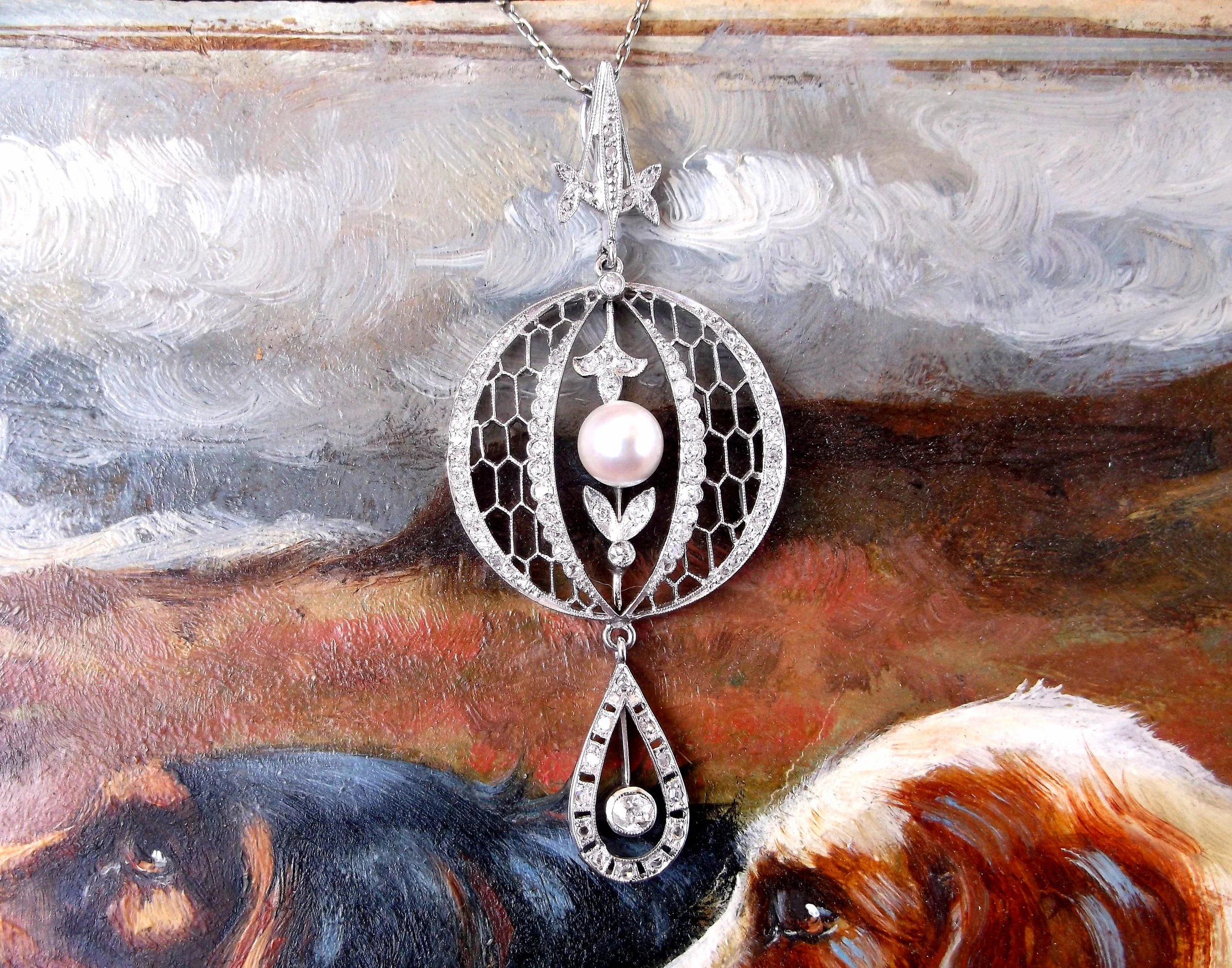SOLD - Complete your wedding look with this gorgeous, intricate 1920's diamond and pearl filigree pendant! (The pendant is approximately 2.25" in length from the top of the bale to the bottom of the pendant. The circular portion in the center is approximately 1" in diameter.) Shop this necklace HERE