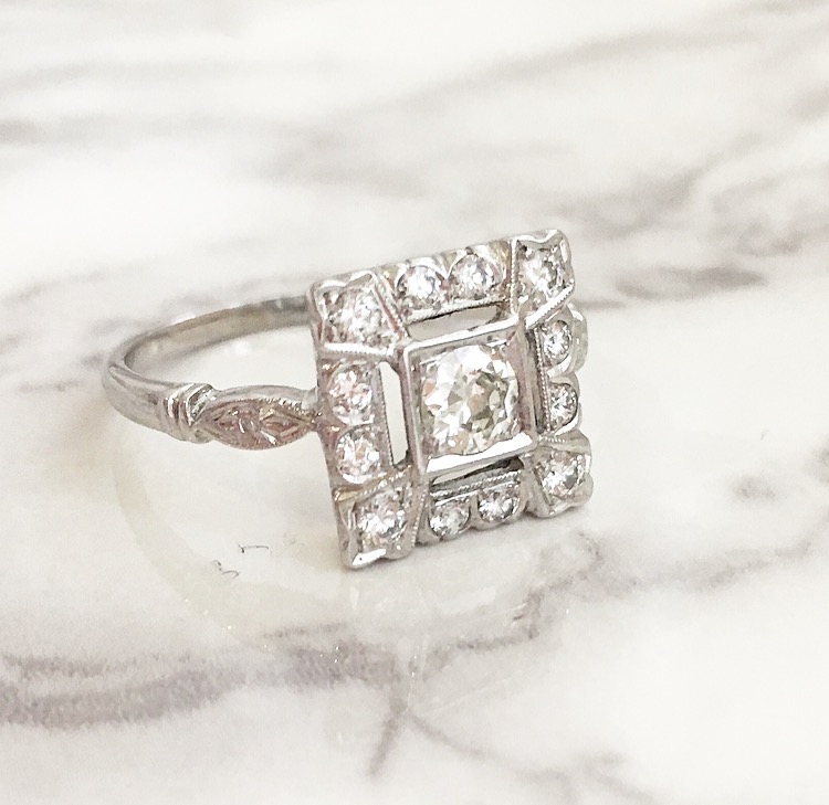 SOLD - An Old European cut diamond with a 1950's twist! The ring features a center 0.30 carat Old European cut diamond set in a lovely 14K white gold 1950's diamond setting. Shop this ring HERE