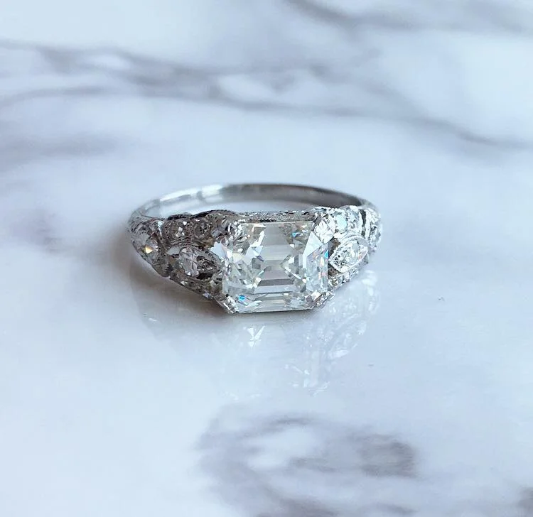 SOLD - Dream worthy 1920's 2.06 carat step cut diamond set in a gorgeous platinum mounting with 0.25 carats in accent diamonds! Shop this ring HERE