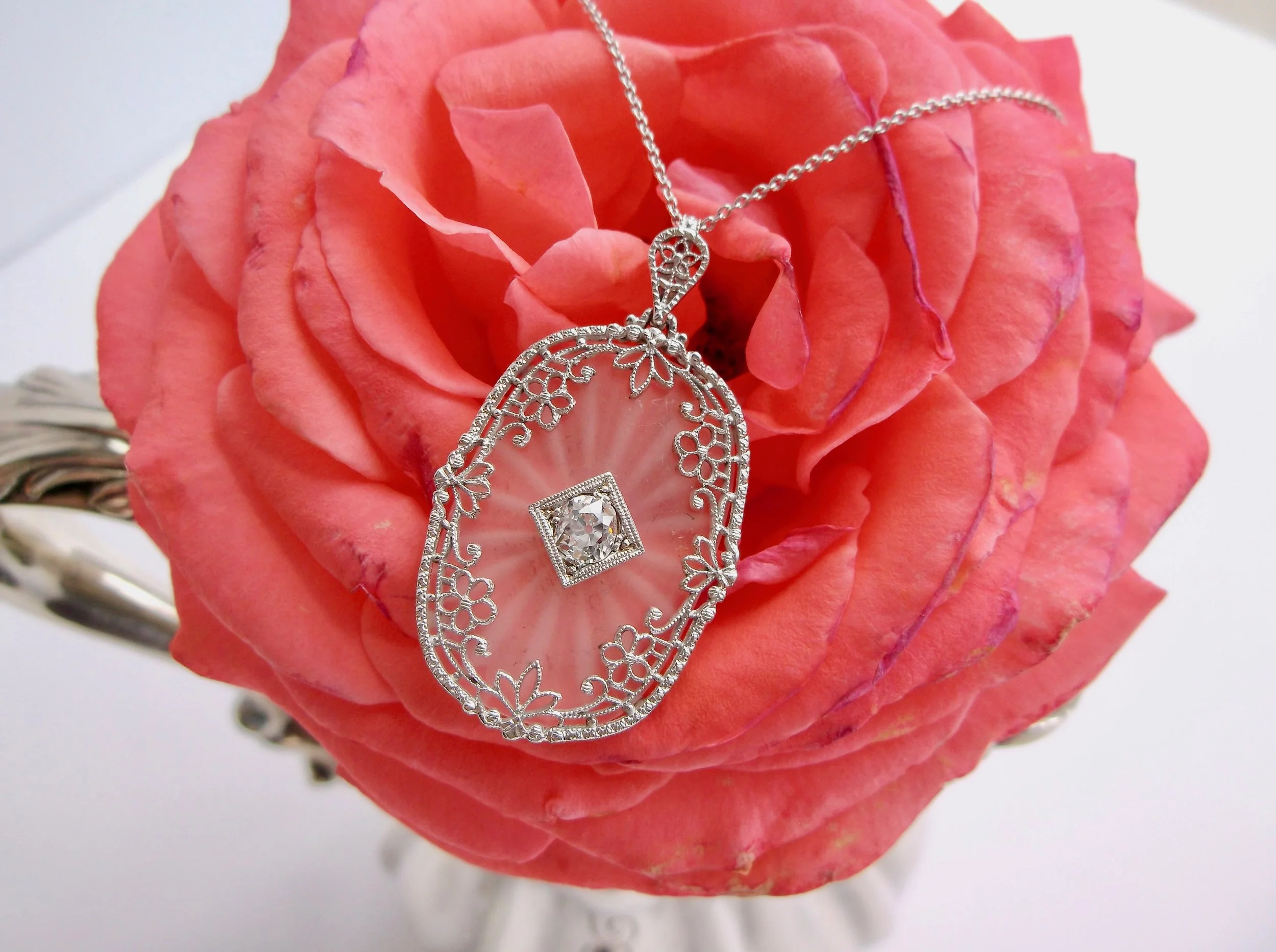 SOLD - Feminine and delicate, enough to make you swoon! 1920's carved quartz necklace set with a beautiful center 0.45 carat Old Mine cut diamond with lovely white gold details. Shop this necklace HERE