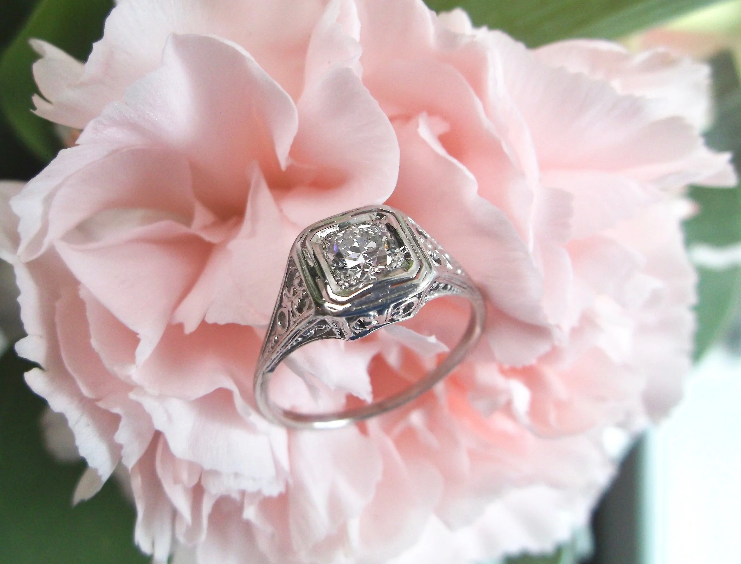 We are loving the intricate details in this 1920's Old European cut diamond ring! The ring features a 0.40 carat Old European cut diamond in the center, set in a beautiful filigree platinum mounting. Shop this beautiful ring HERE