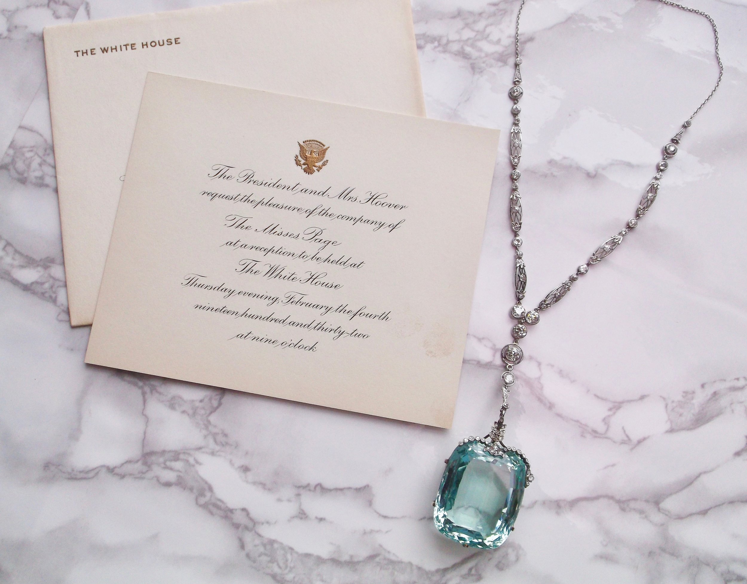 Meet Miss Page. This jaw droping-ly gorgeous 180 carat aquamarine, diamond and platinum necklace has been to the White House! This beauty was worn by Miss Page in 1932 to a White House dinner hosted by President Hoover and First Lady Hoover. The invitation reads: "The President and Mrs. Hoover request the pleasure of the company of The Misses Page at a reception to be held at The White House Thursday evening, February the fourth nineteen hundred and thirty-two at nine o'clock." This stunning piece can be yours (to wear to The White House, or, you know, just with your pj's on the couch!)! Shop HERE