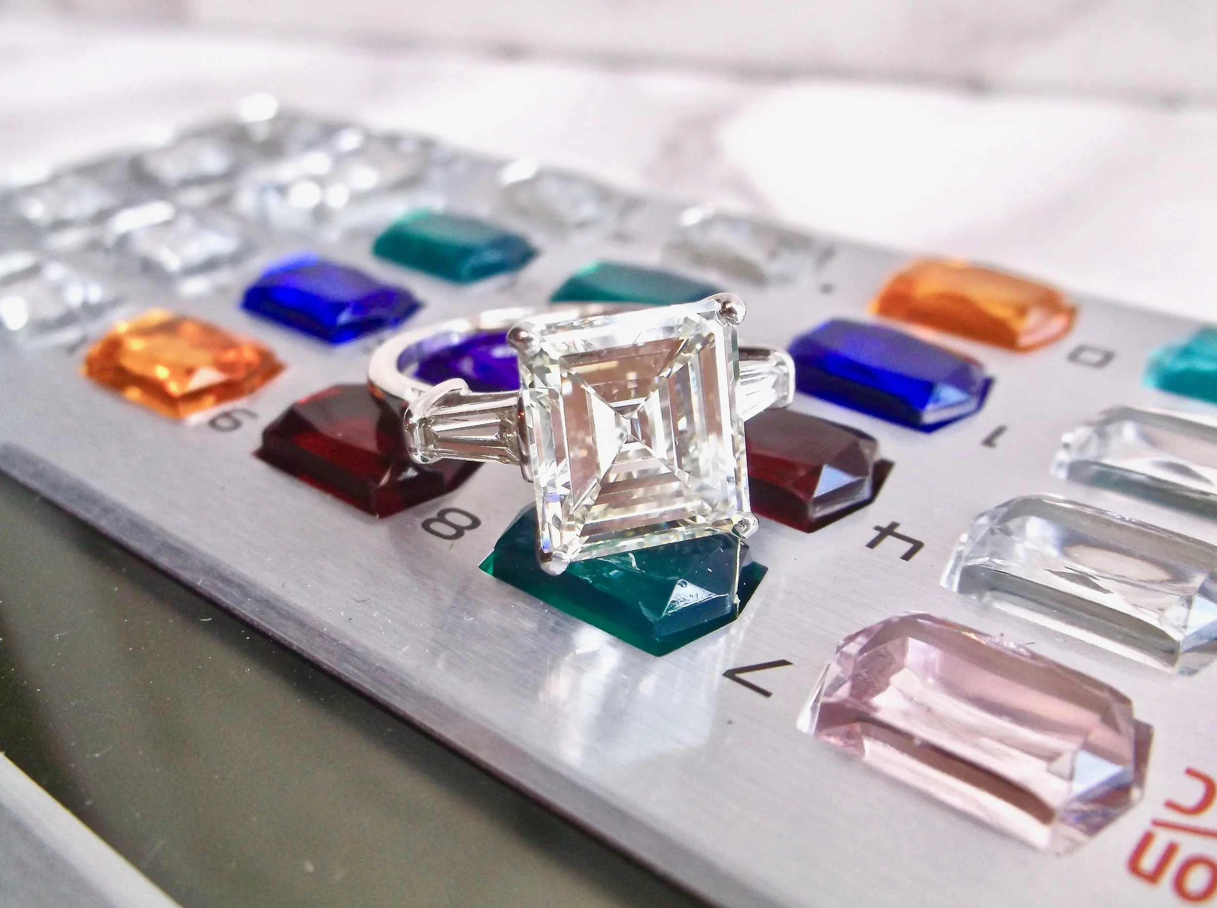 We're crunching some numbers trying to figure out how all of the Walton's ladies can share this bad boy! A fabulous 5.20 carat asscher cut diamond set in a platinum and baguette cut diamond mounting. Shop this stunner HERE