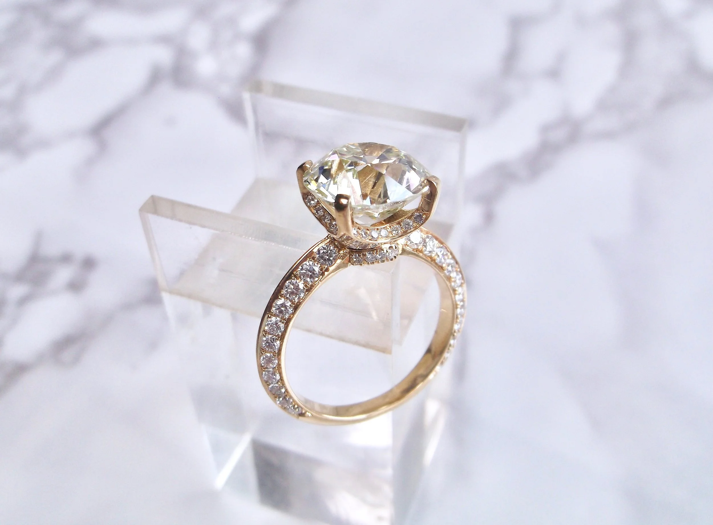 Diamonds on diamonds on diamonds! Every inch of this beauty is covered in diamonds! Featuring a 5.04 carat center Old European cut diamond, this ring has a definite WOW factor! Shop this stunner HERE .