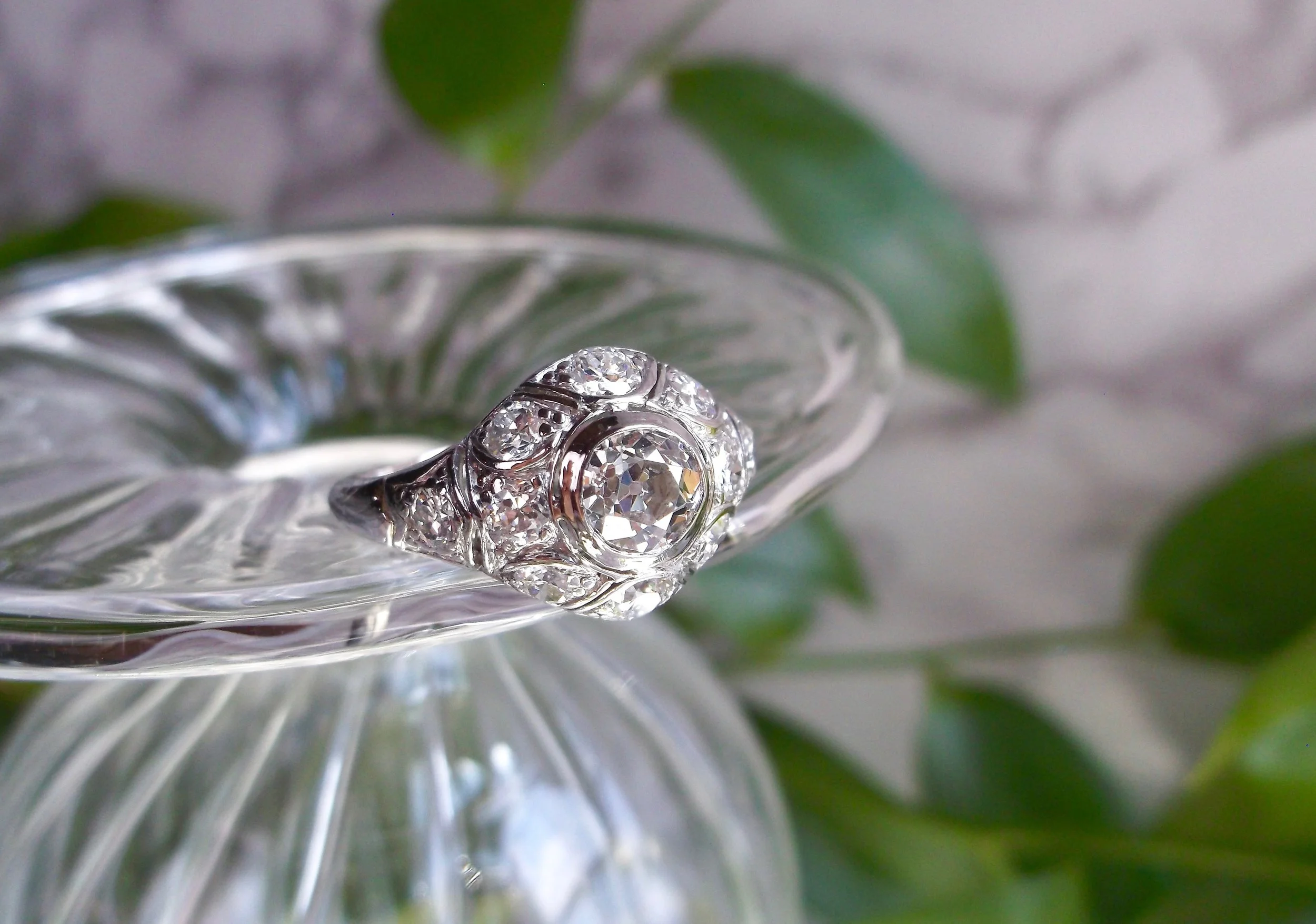This Art Deco beauty sure lights our fire! Featuring a center 0.50 carat Old European cut diamond surrounded by 1.00 carat in Old European cut accent diamonds, it's fiery from every angle! Shop this ring HERE . 