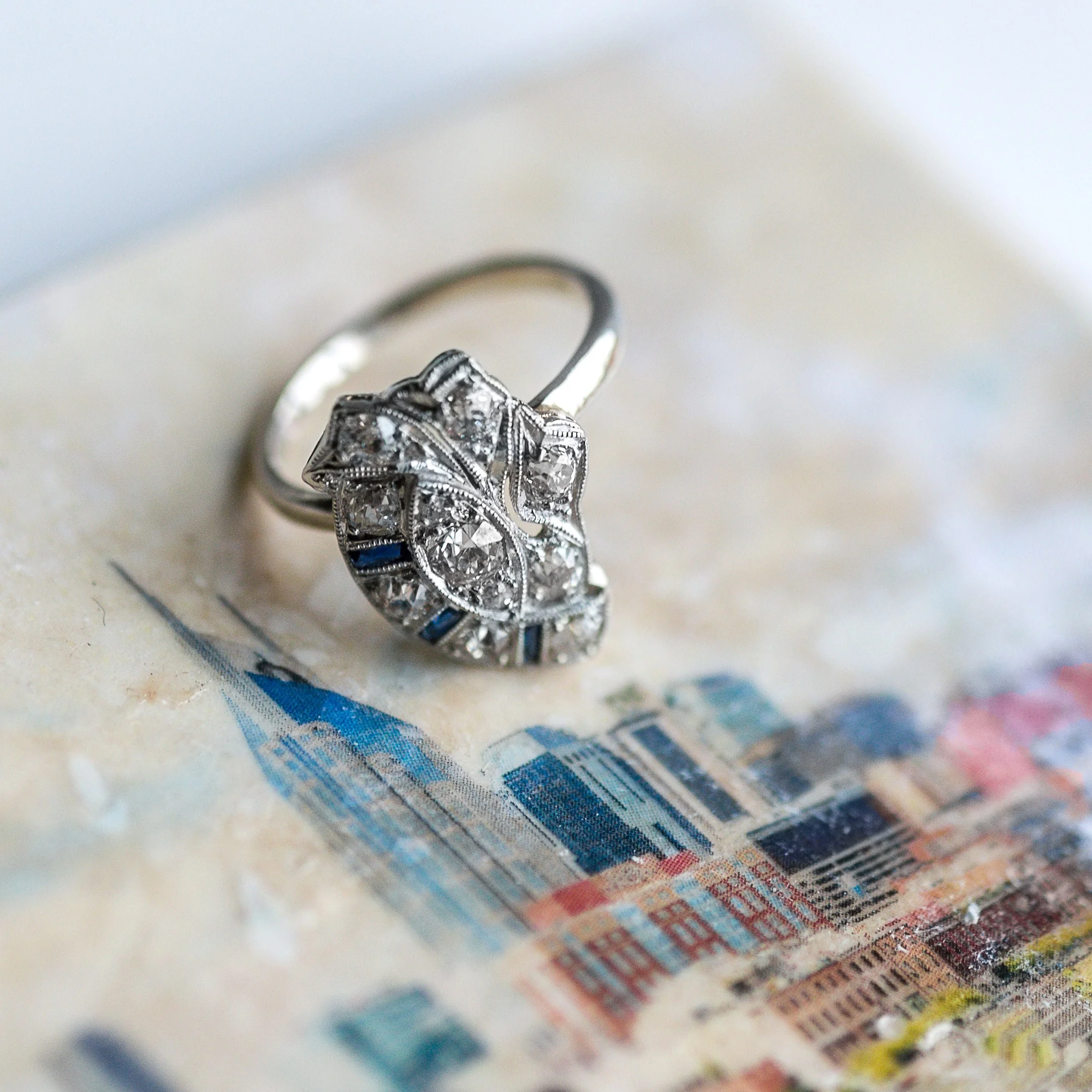 Bright lights, big city ๐๐๏ธ We are loving this Art Deco diamond and sapphire ring that was once a stick pin! Shop this lovely ring HERE . 