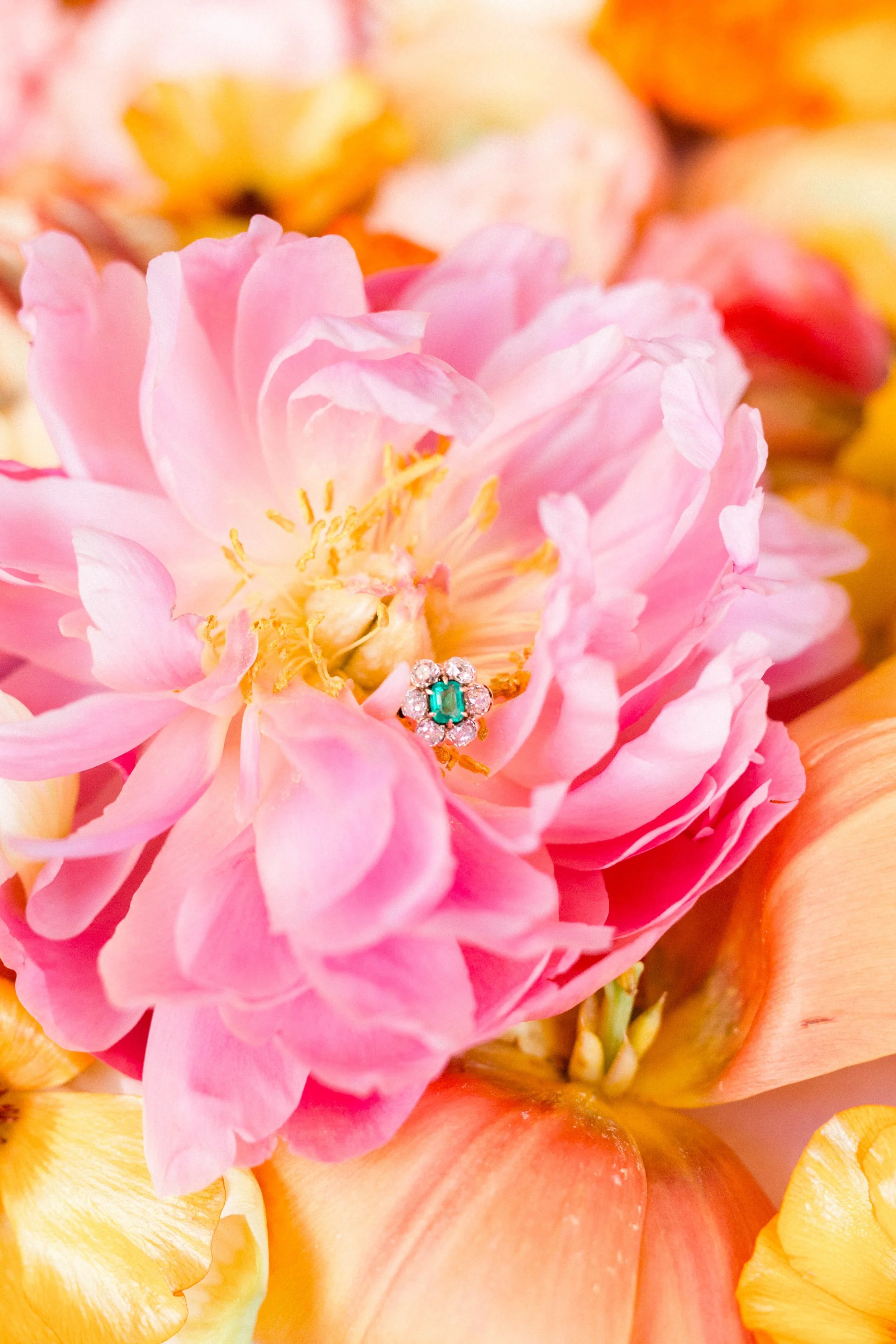 A flower amongst flowers! Shop this fabulous Victorian era emerald and Old Mine cut diamond ring HERE . Photography by Morgan Franklin Creative. 
