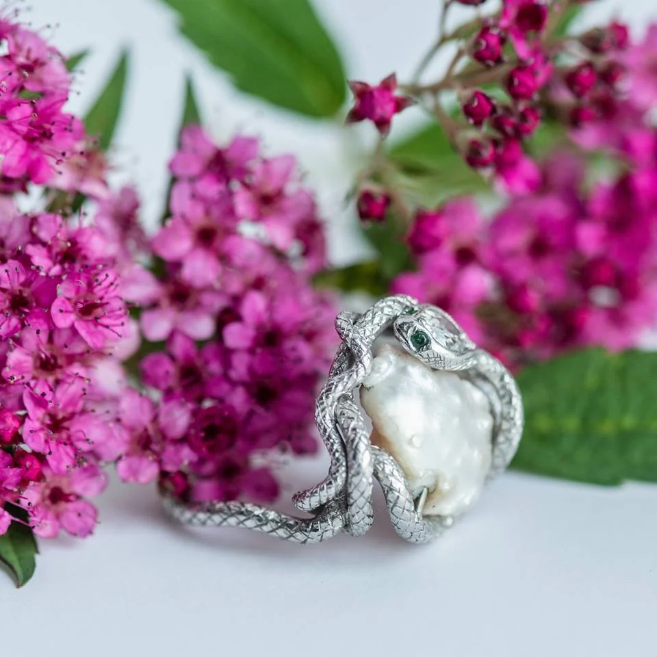FUN FACT π©βπ« Did you know that Prince Albert gave Queen Victoria a snake ring set with her birthstone, an emerald, as her engagement ring? This quickly started the trend for serpentine adornments, which were ancient symbols of eternal love! So sweet πThe ring pictured below was probably crafted some 50 years later, which goes to show the power of influence over ever evolving trends through the decades. ππ Shop this serpentine dream HERE !