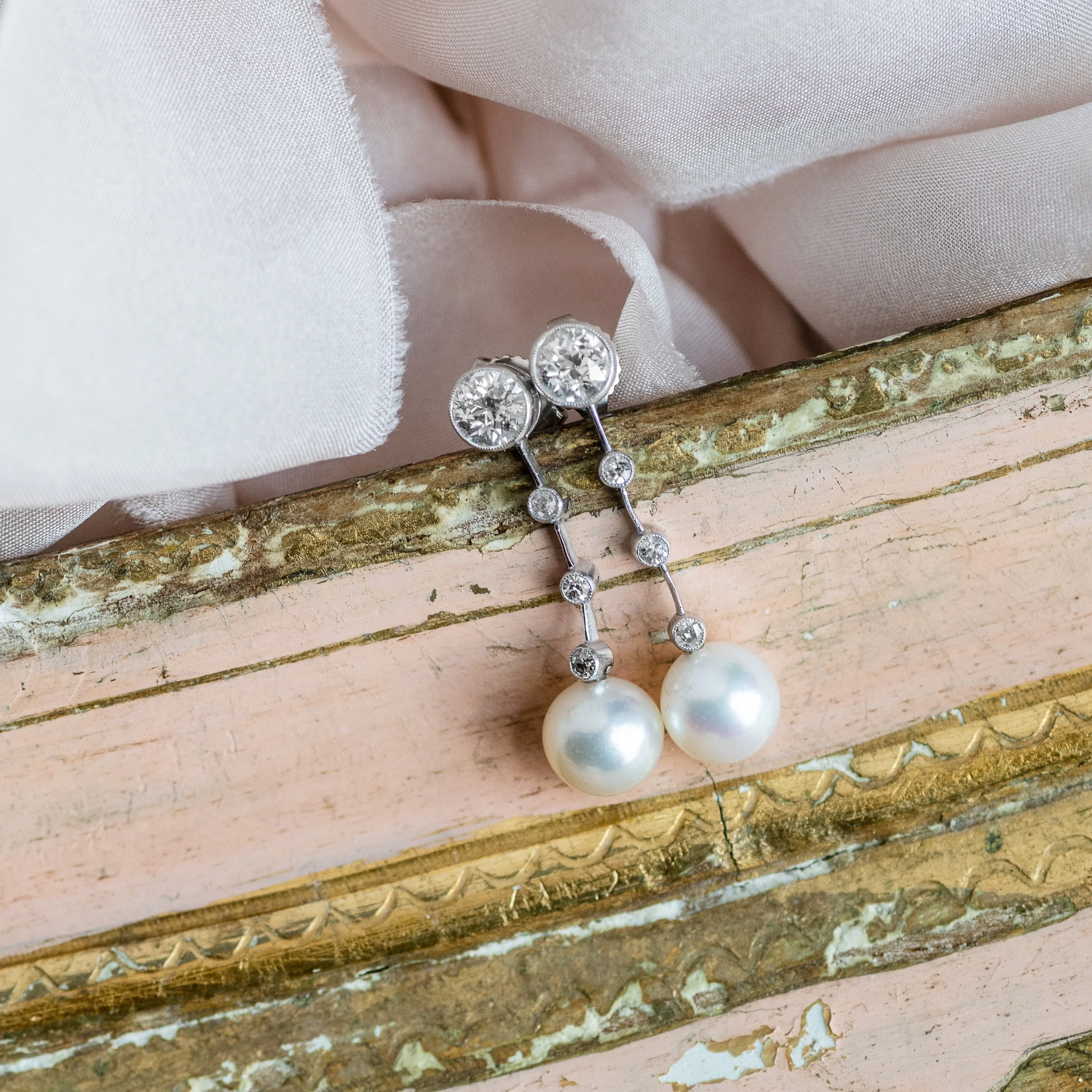 Pearls dangling from a string of diamonds-does it get any sweeter than this?π Shop this lovely pair of Art Deco earrings HERE !