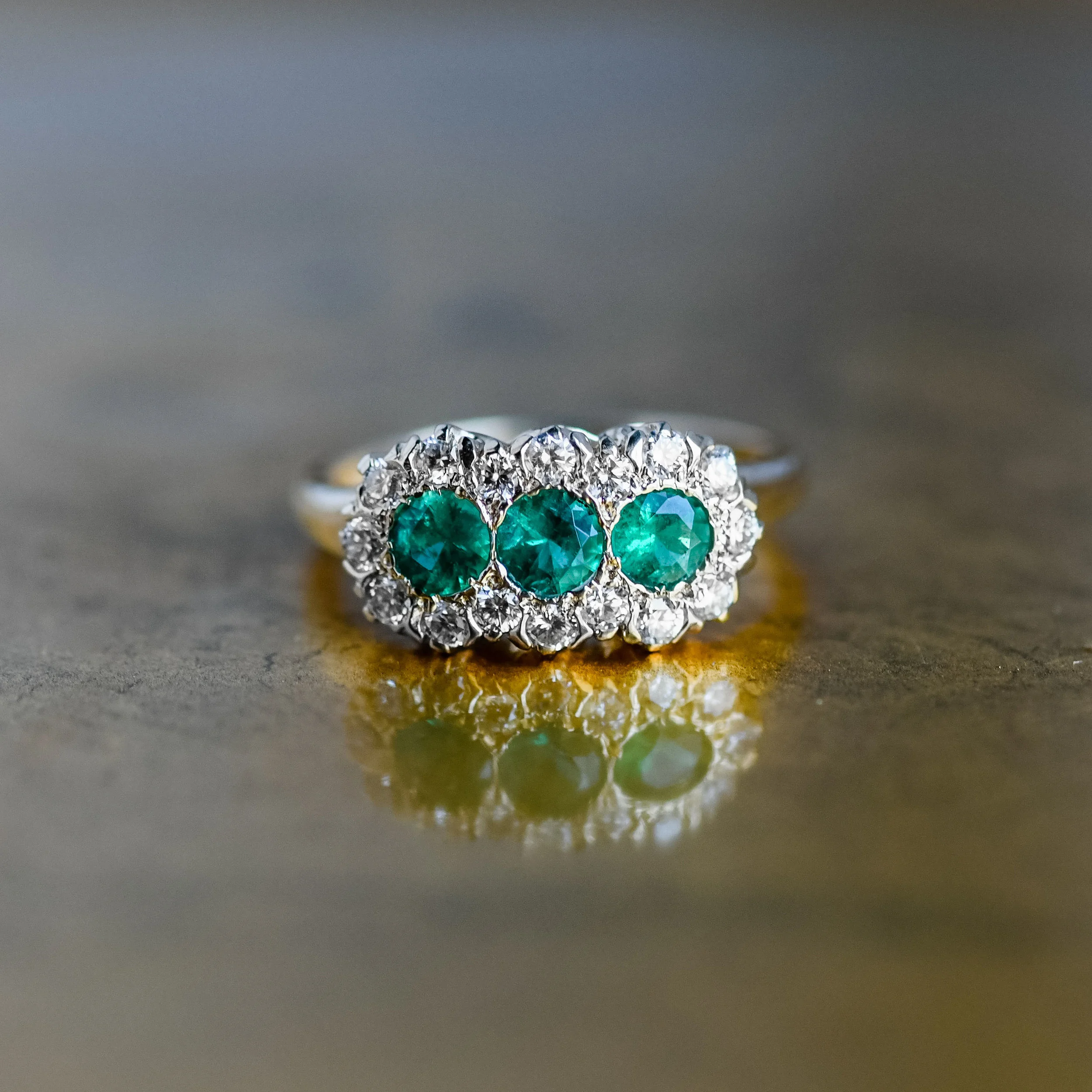 Our hearts are fluttering over this gorgeous diamond and emerald cluster ring! Shop this beauty HERE !