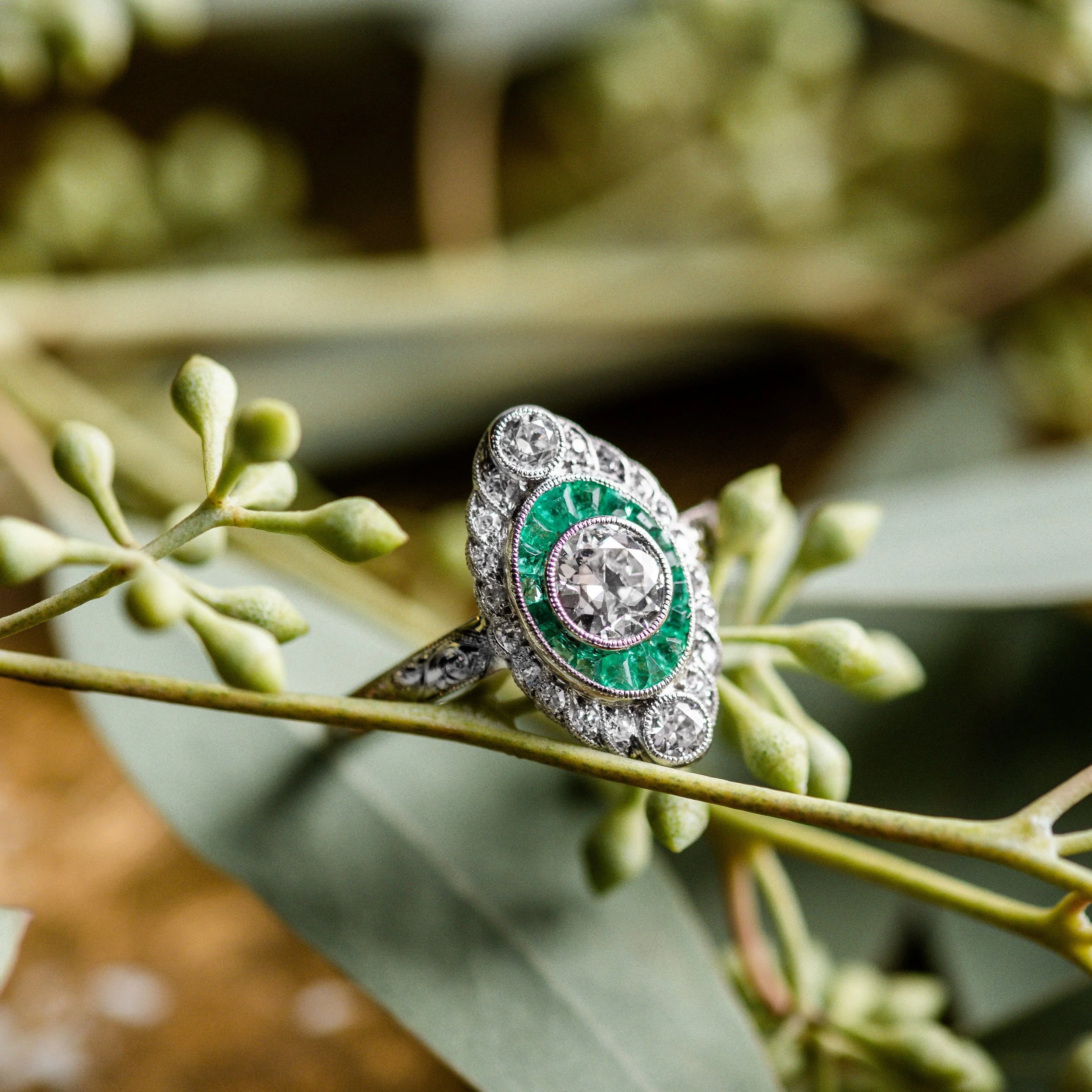 Mesmerizing Edwardian era emerald and diamond ring featuring a center 0.50 carat Old European cut diamond. Click HERE to shop this beauty!