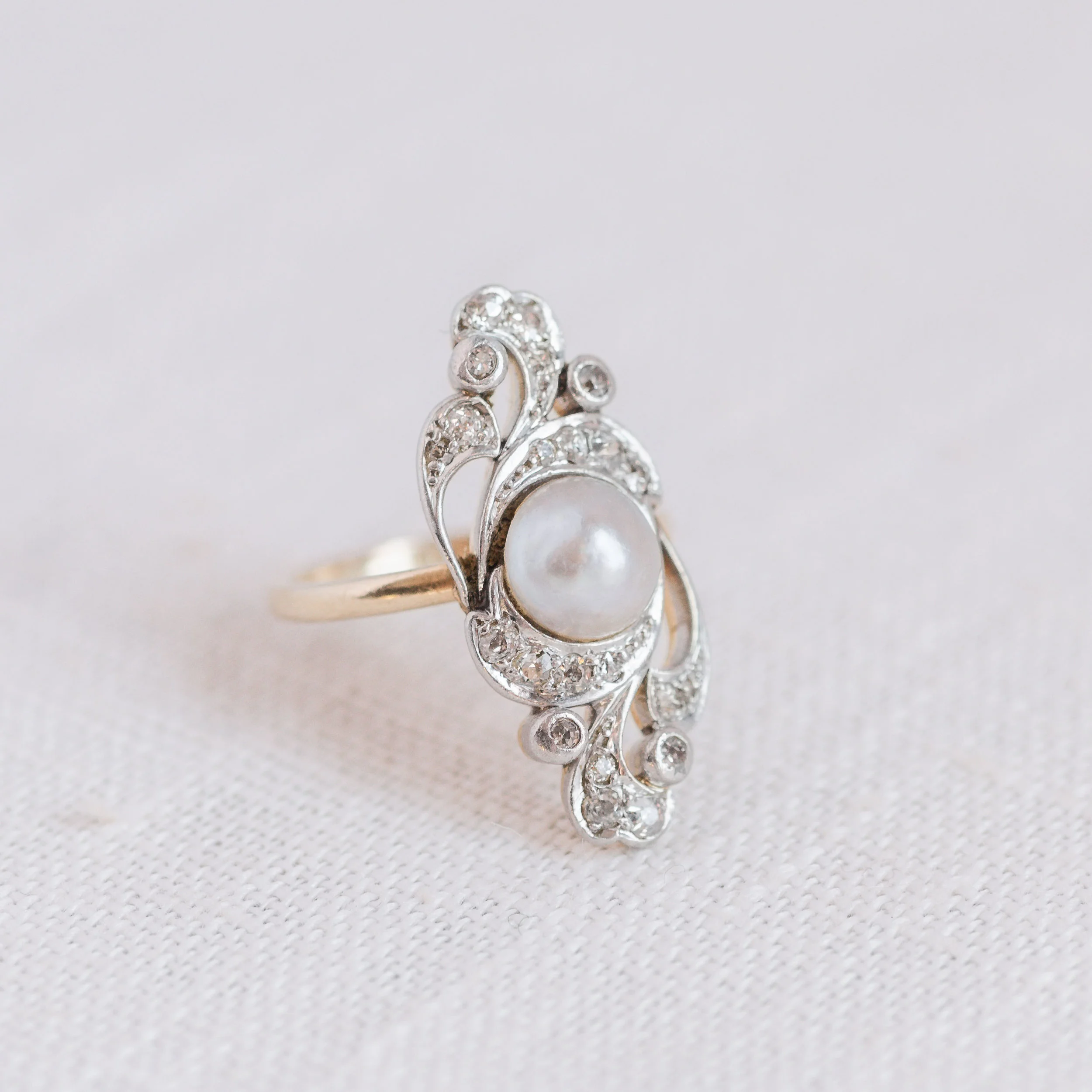 Get swept away in the elegant spirals of diamonds in this romantic Old Mine Cut Diamond and Pearl Ring. Shop this beauty HERE