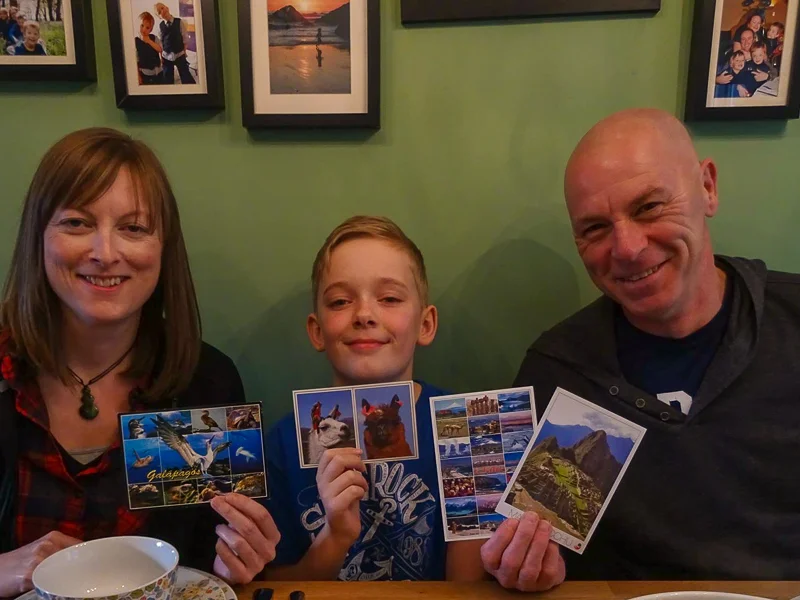 an amazing young man with our postcards