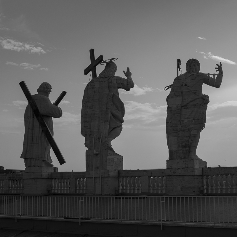 statues_at_the_top_of_st_peters_basilica.jpg