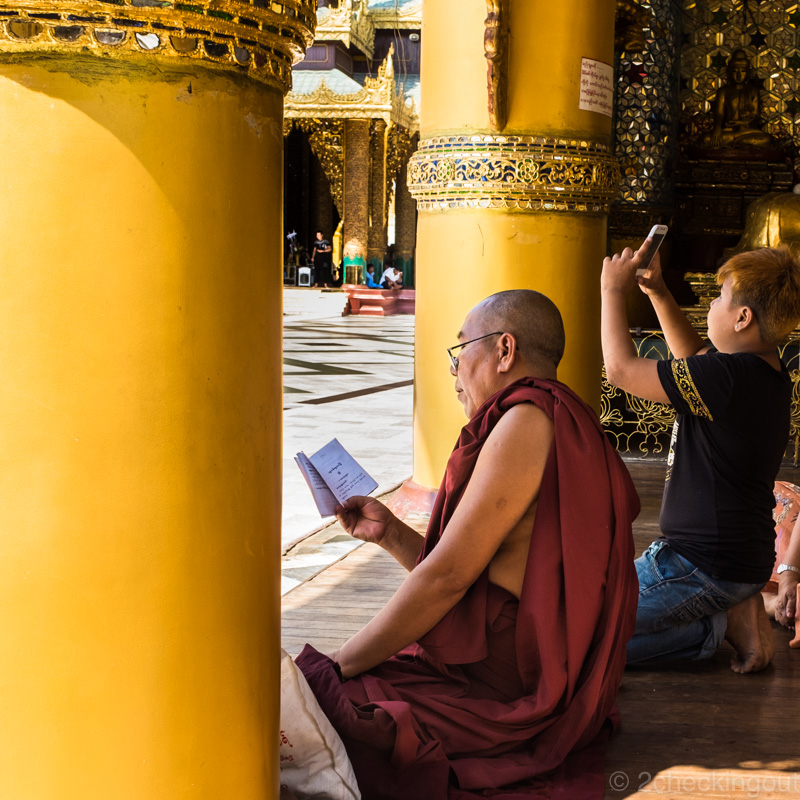 monk_reading_boy_smartphone_shwedagon-pagoda_yangon_myanmar.jpg