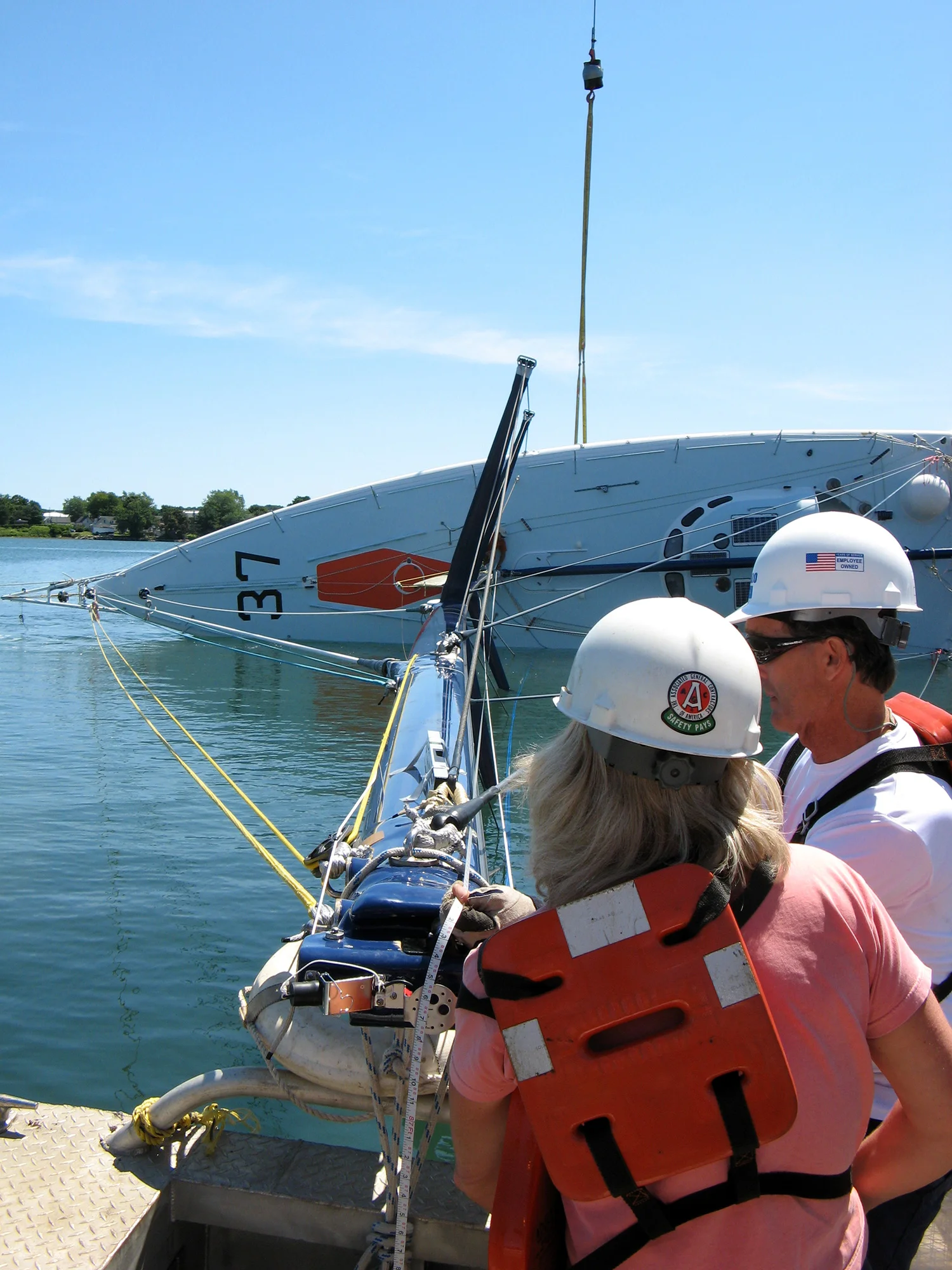The crane then releases the the load
on the keel and the boat is held at 90 degrees by the masthead tether.
The force required to do this is then measured on the masthead load
cell. By knowing the weight of the boat, the CG and the load at the
masthead with the boat at 90 degrees, the AVS can be accurately measured.
