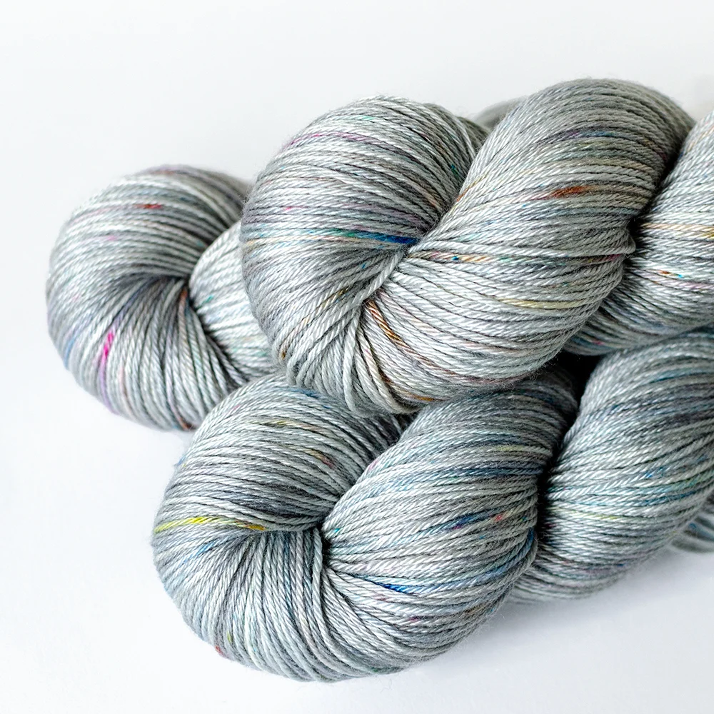 50/50 NSW Fingering- $32 50% Merino Wool (untreated), 50 % Silk 4 plies 435 yards / 398 meters 100 grams Fingering Weight US 5-7 / 3.75-4.5mm Hand wash / Dry flat This blend of untreated merino wool and silk is soft, light, and lofty. It has more loft and lightness to it than the superwash merino version.