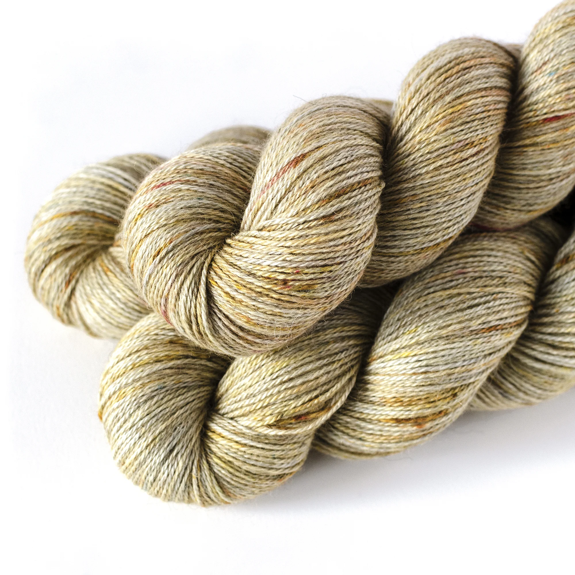 Alpaca S/C - $32 70% Alpaca (either light grey or ecru), 20% Silk, 10% Cashmere 3plies 435 yards / 398 meters 100 grams Fingering Weight US 1-5 / 3.75-4.5mm Hand wash / Dry flat This is a soft yarn with a subtle halo from the alpaca content. This comes in a natural ecru alpaca or natural grey alpaca.