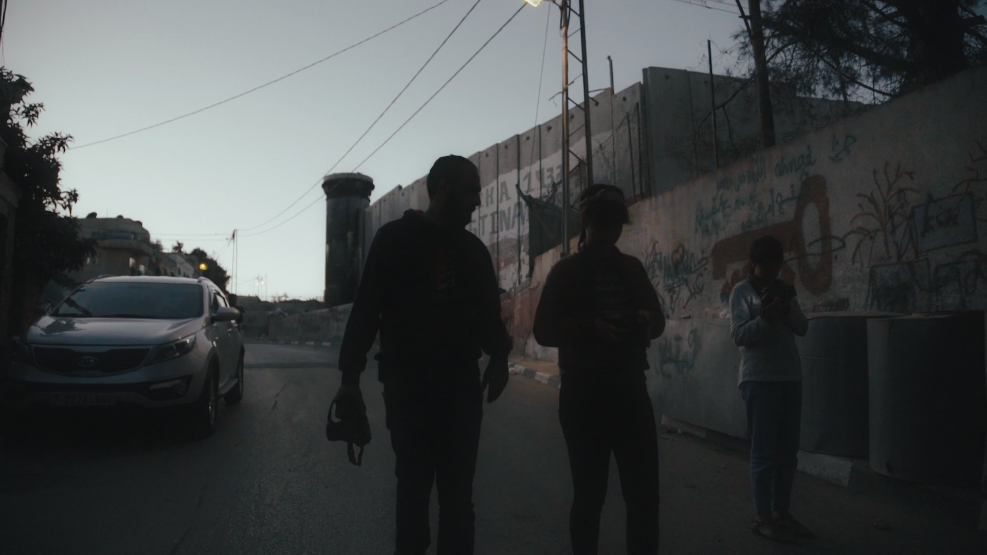 Mohammad Alazza (left) teaches the youth of Aida Refugee camp the skills of photography. Courtesy: Hurdle