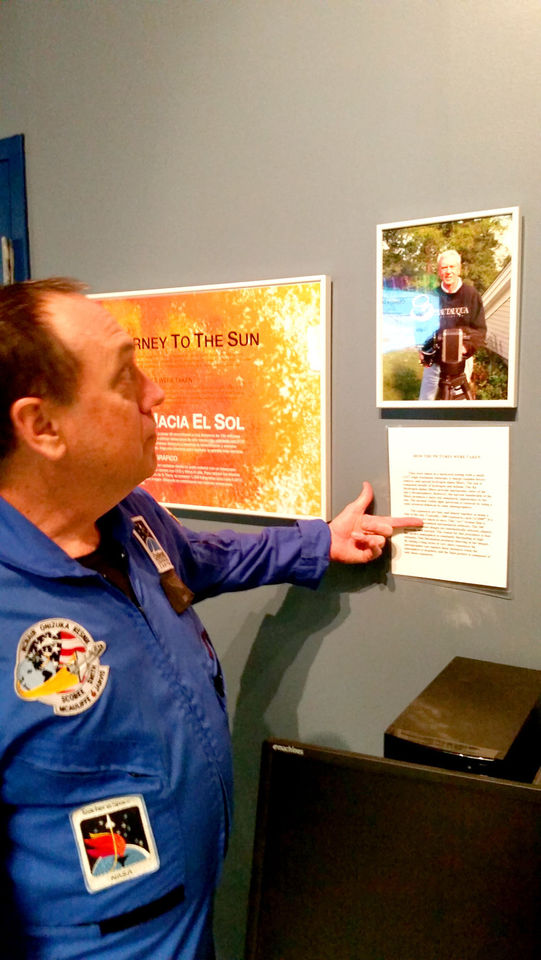 'JOURNEY TO THE SUN' Fred Welch, Dresser-Rand Challenger Learning Center director, highlights “Journey to the Sun,” a gallery of highly detailed photos of the sun taken from ground level in Chautauqua County by photographer Ted Wolfe. The gallery will now be a semi-permanent fixture at the Challenger Learning Center in Allegany and will be available for free at each center in the country.