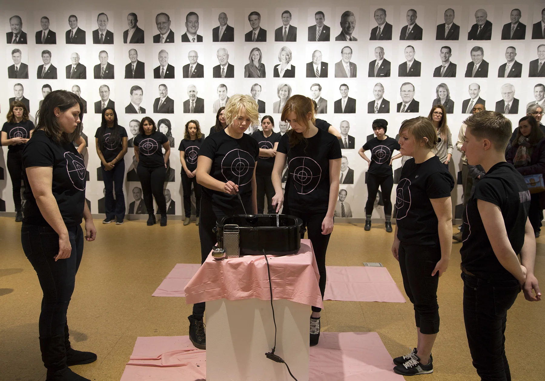 Title: To(get)her: Conversation/Collaboration/Confrontation, Stirring of the Gun Media: Screen printed tee shirts, cast wax assault rifles, inkjet posters, domestic tools, "Pink Blink" nail polish, performance Size: N/A Date:&