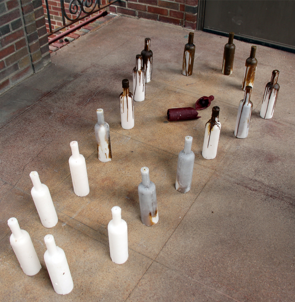 Title: Coffin Course: Elements of Sculpture Unit: Multiples… Multiplying! Student: Victoria Niewinski Media: Cast Wax Dimensions: 6’ x 3’ x 14” Date: Spring 2017 Brief Description: Niewinski wanted to discuss issues of alcohol abuse and created a coffin out of cast wax wine bottles.