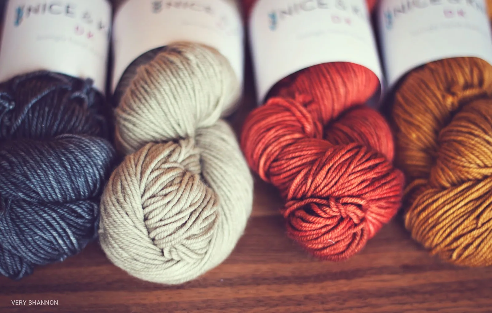 Nice and Knit DK in colorways (left to right) Harpoon, Oyster, Lobster Pot, Dockside. Blue shown in middle pic is Canal.