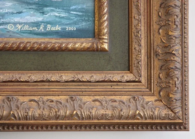 Close-up of frame on The Heritage by William R. Beebe