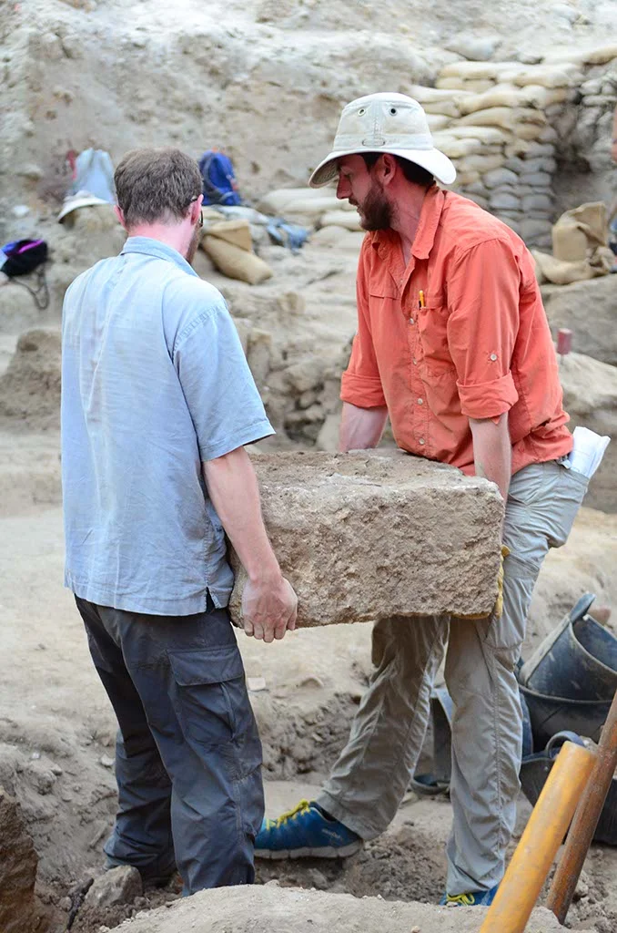 Co-Grid Supervisor Jonathan Wylie and Ben move a big stone