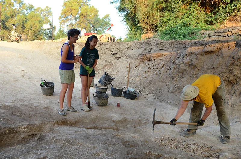 Ethan excavates a plaster subfloor in Grid 47