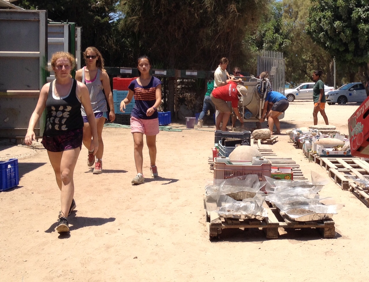 Carrying the flot machine through the compound
