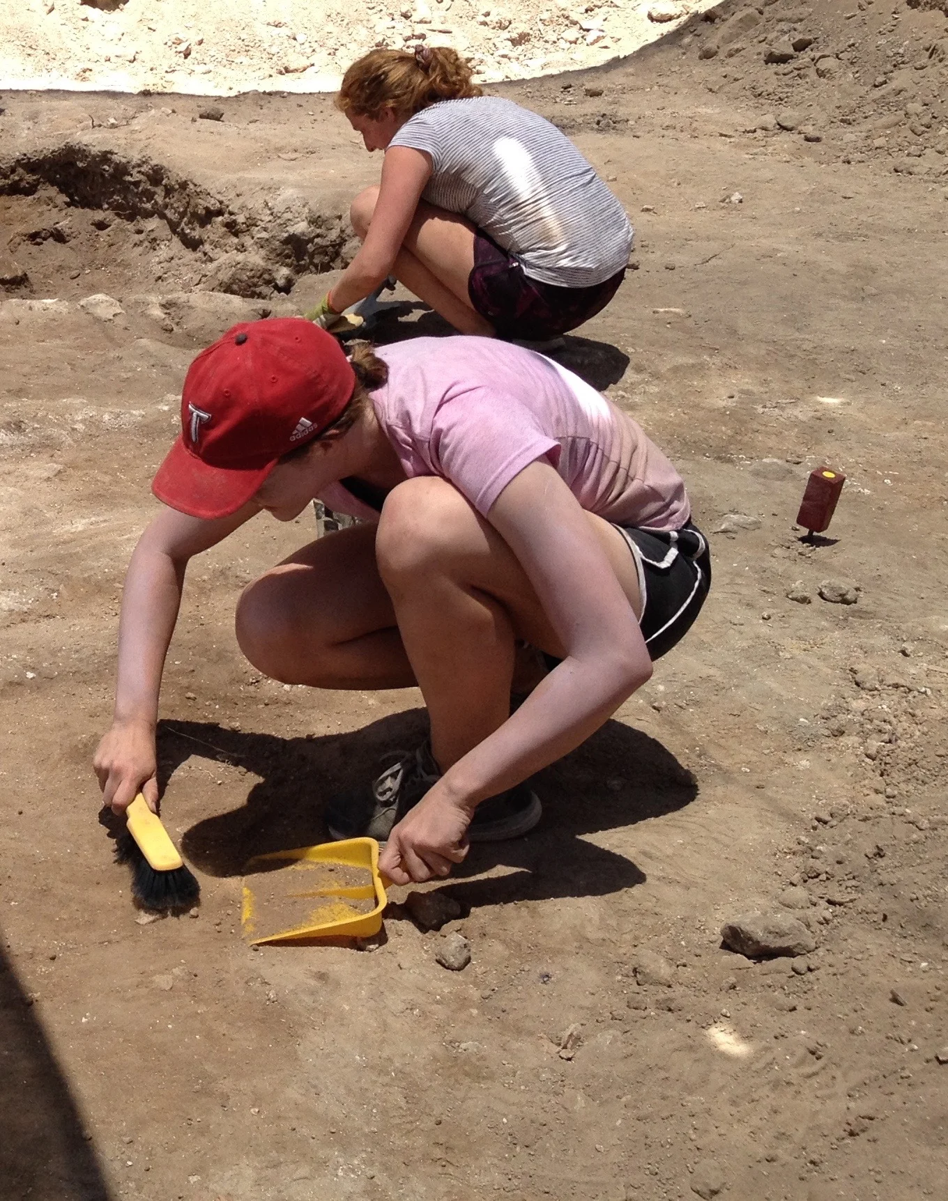 Cleaning in preparation for excavation in Grid 47
