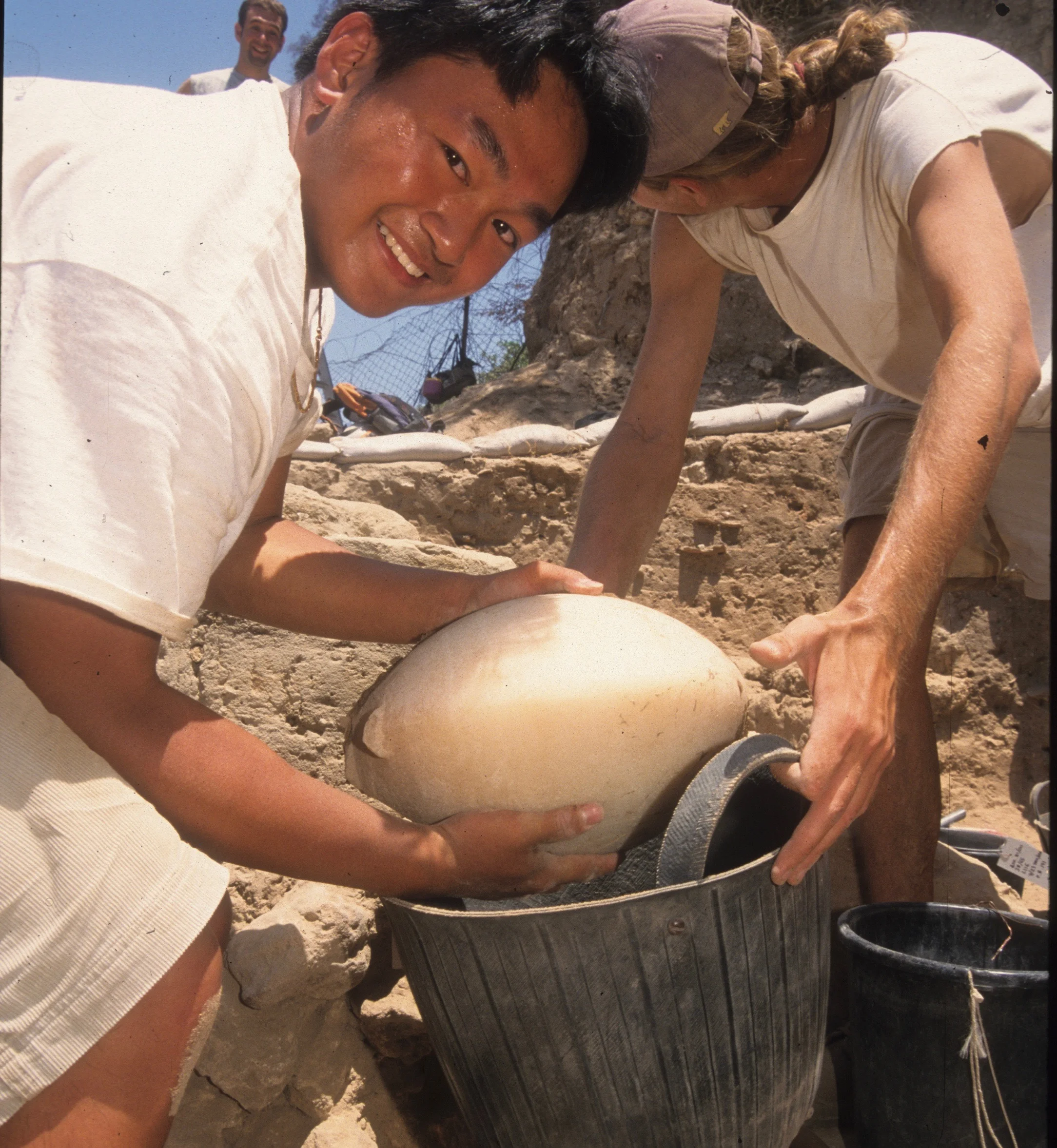 A nearly complete jar gets ready for its trip to the Pottery Compound.