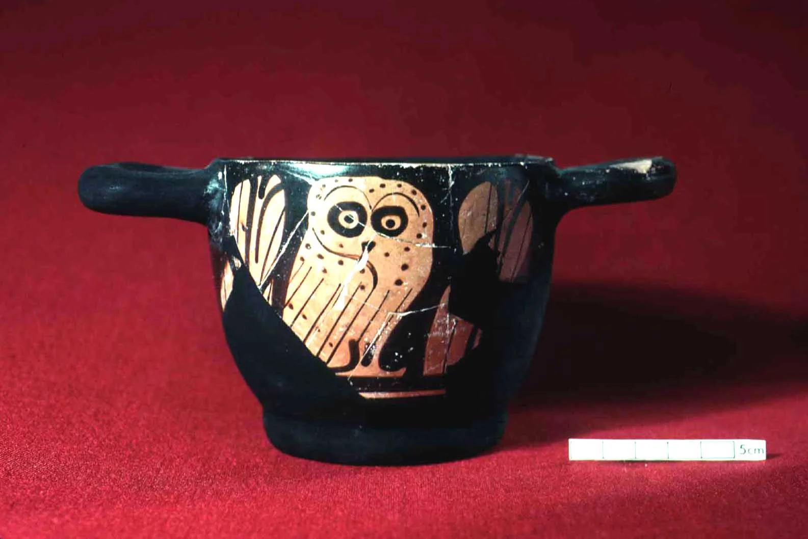 Attic Red-figured cup with an owl.