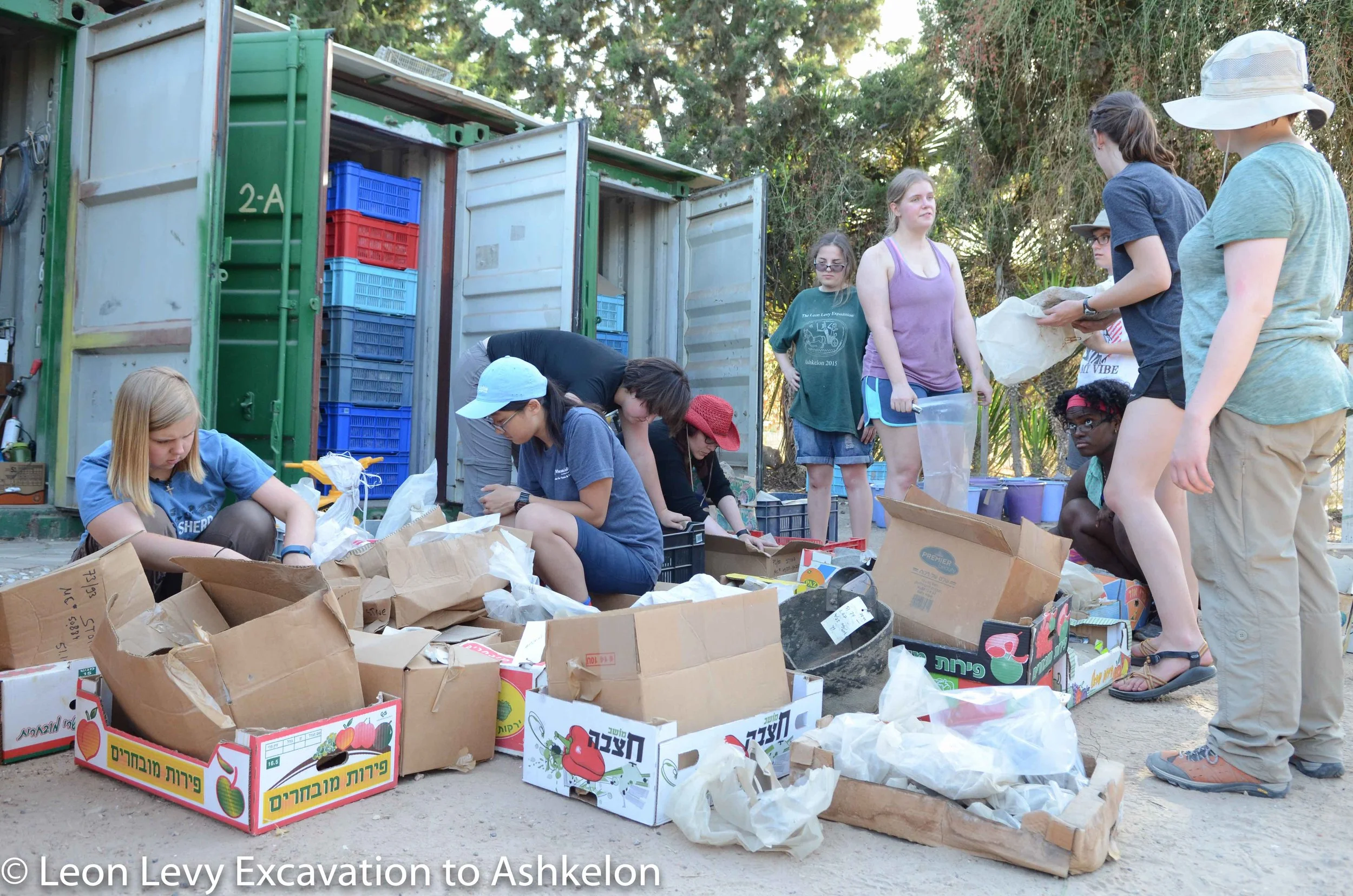 Sorting through objects in the pottery compound
