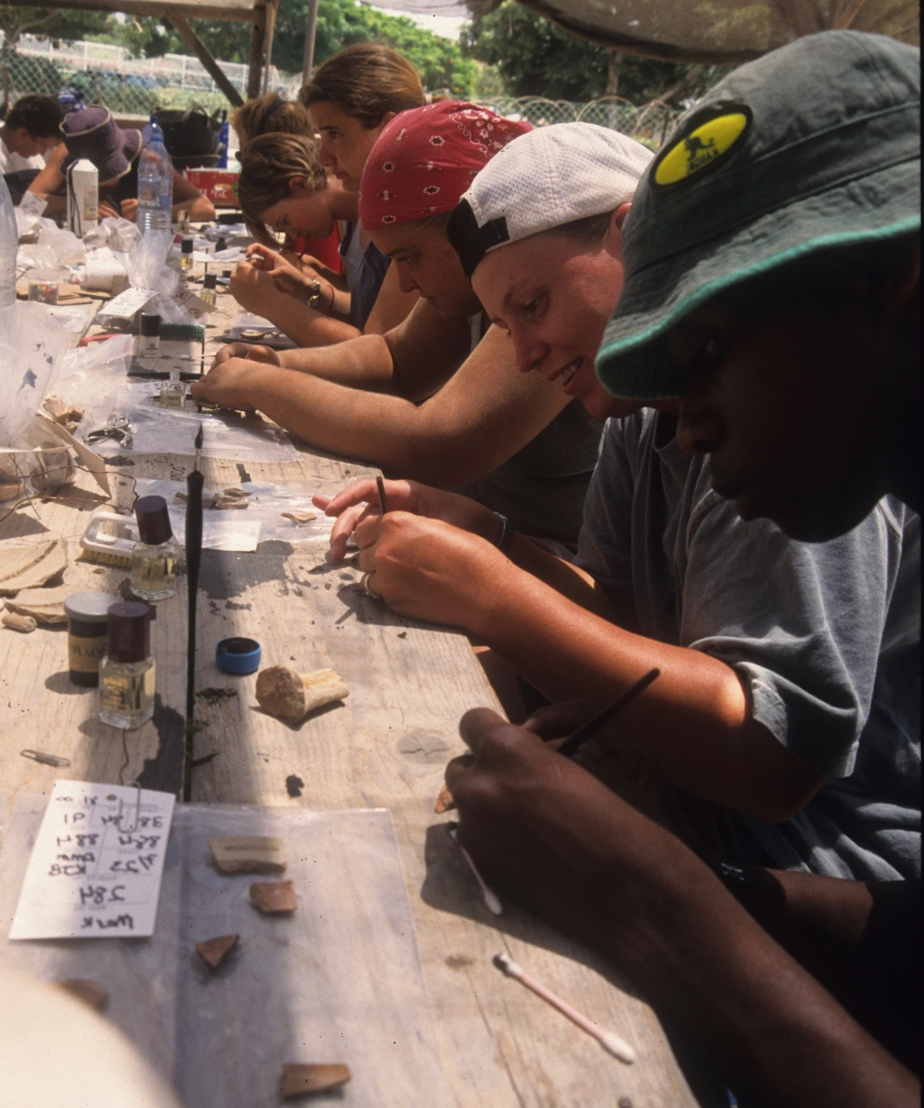 Pottery marking with fingernail polish and ink.