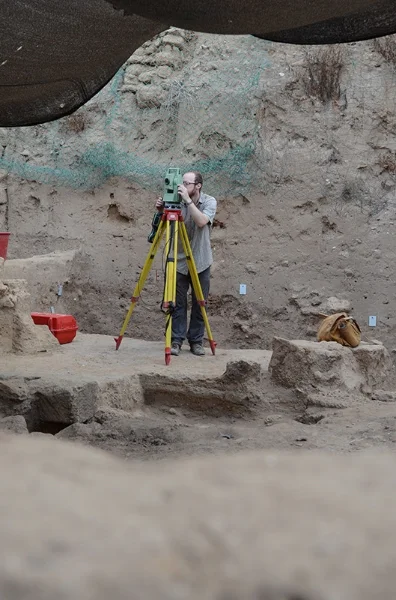 Ben, a member of the GIS team, working with the total station