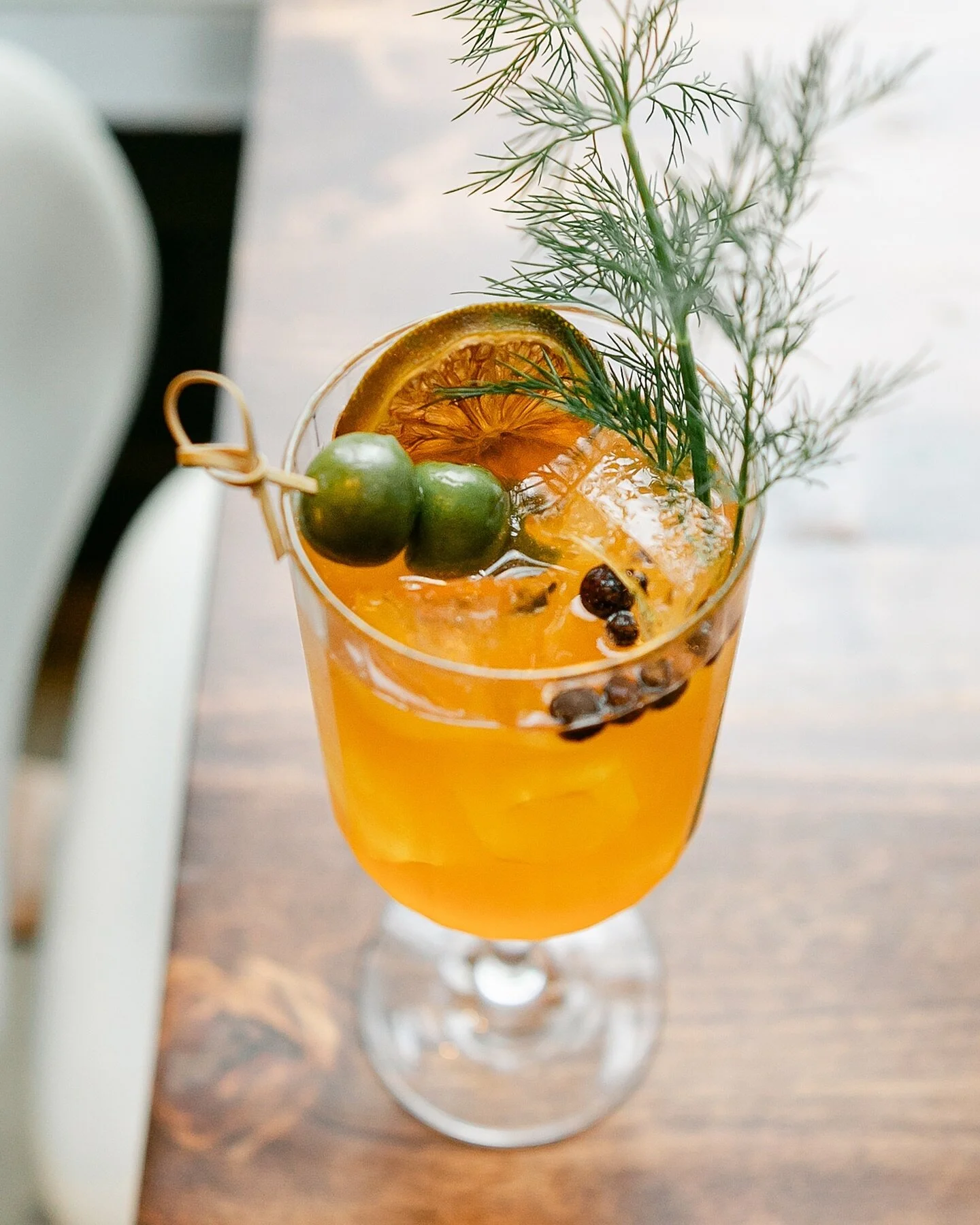 We keep our seasonal Spanish Gin &amp; Tonic on tap so this not-to-be-missed delight is ready at a moment&rsquo;s notice. Our blend of saffron infused gin, housemade tonic, olives, lime and a perky dill frond is refreshing and balanced and oh so deli