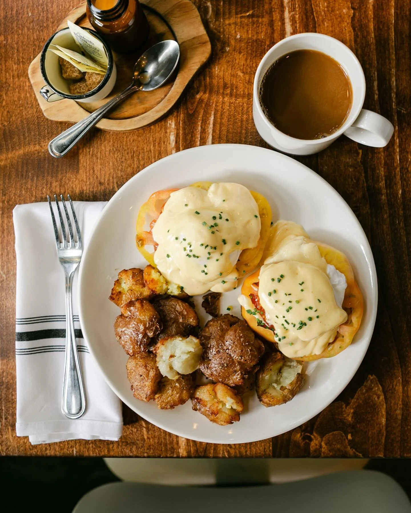 🍅&nbsp;Last Call for Heirlooms on Benedict!
For the next week or so, our Eggs Benedict comes with thick, juicy slices of heirloom tomato&mdash;topped with our housemade hollandaise and served alongside smashed potatoes.
A seasonal twist on a Firesid