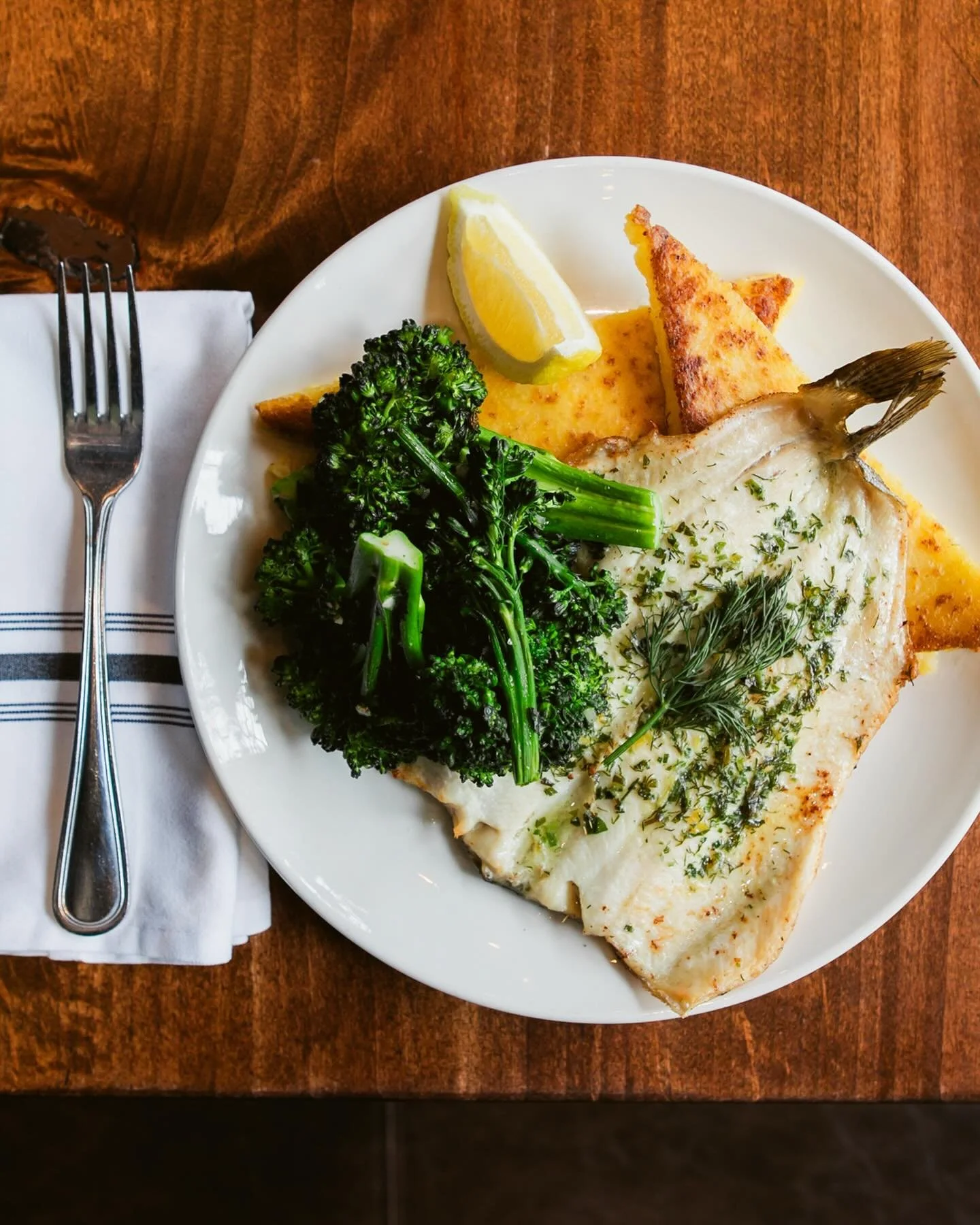 Fresh on the menu:&nbsp;PAN SEARED TROUT

Whole Idaho trout seared until crisp and finished with herb lemon butter, served with golden polenta cakes and roasted broccolini with garlic and shallot. (gf)

Bright, flavorful, and just right for the longe
