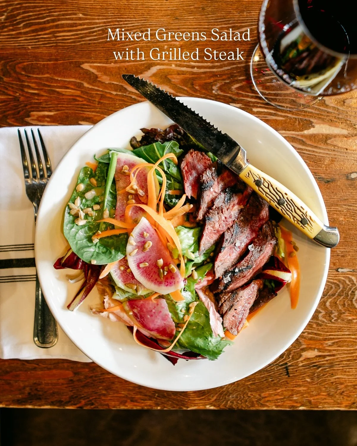 🌱 Our Mixed Greens Salad (Stoneboat Farms greens, verjus vinaigrette, toasted sunflower seeds, carrots, and radish) is a guest favorite for a reason. 

Great on its own and even better with grilled steak. 

Add our Crispy Brussels Sprouts and a glas
