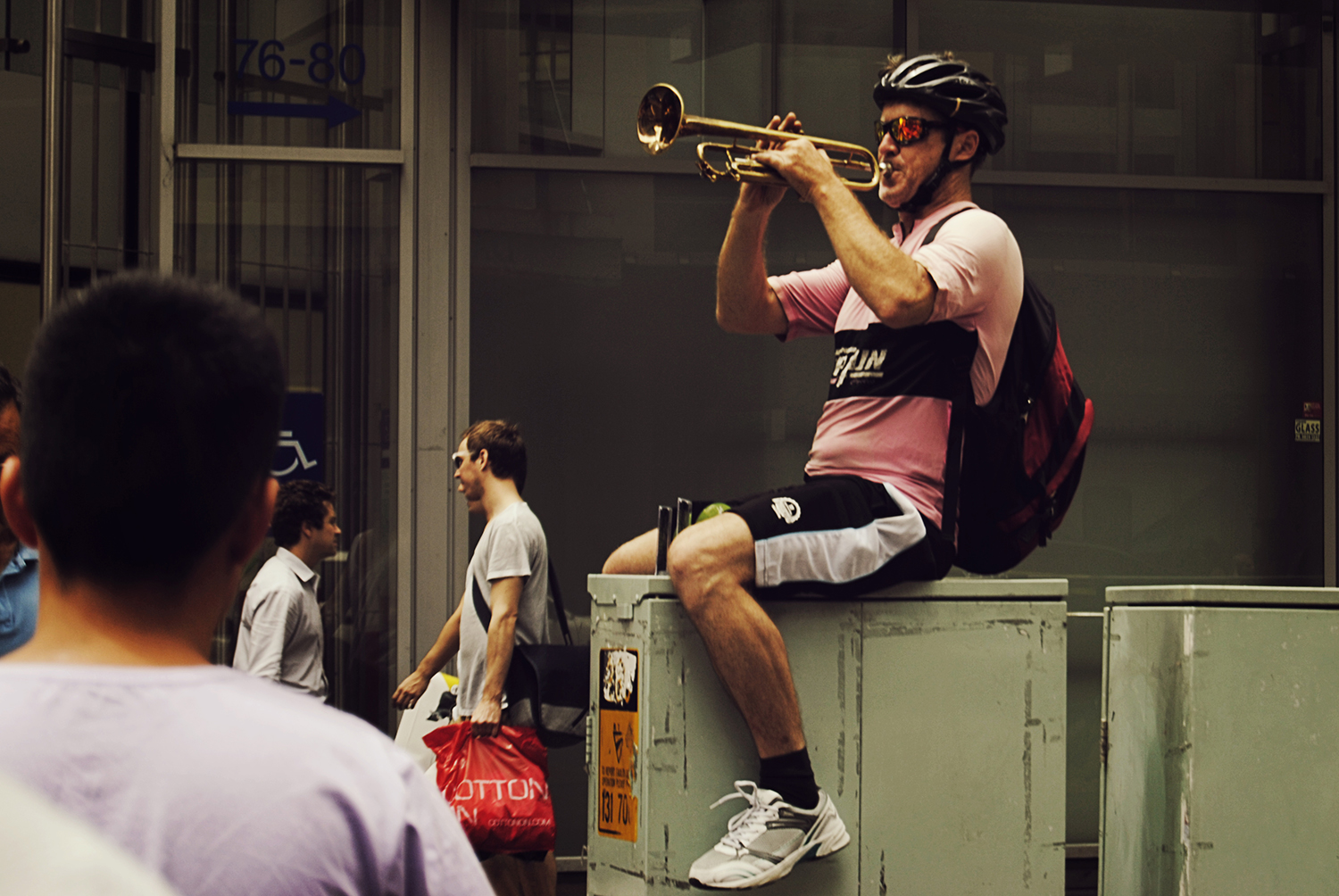 a man playing music to the pedestrians