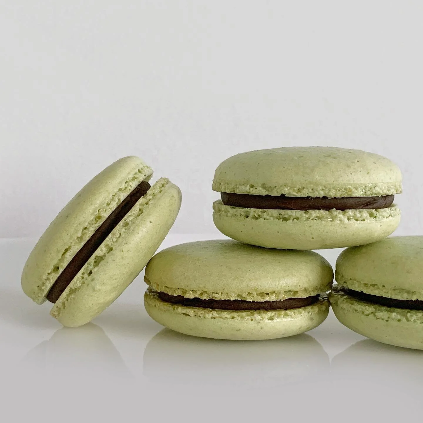 pistachio shells x chocolate ganache + pistachio paste
.
.
I broke my Vitamix making the pistachio paste for these macs. I was being lazy and trying to avoid cleaning all of the components of my food processor. I was like, oh yeah I&rsquo;ll just do 